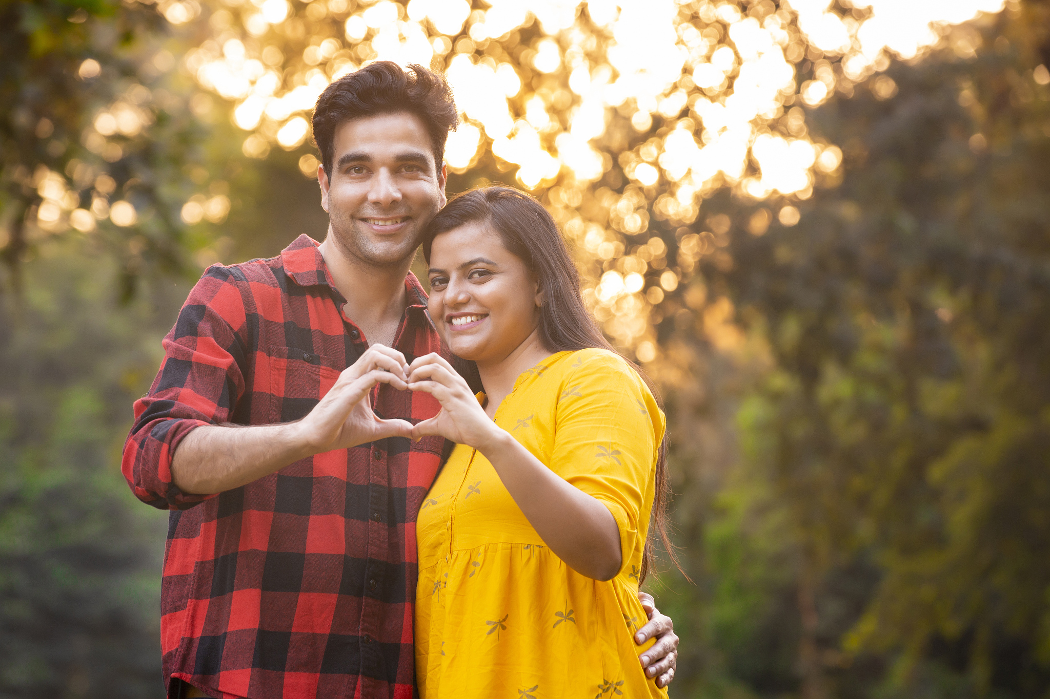 happy young couple in a city park stock photo