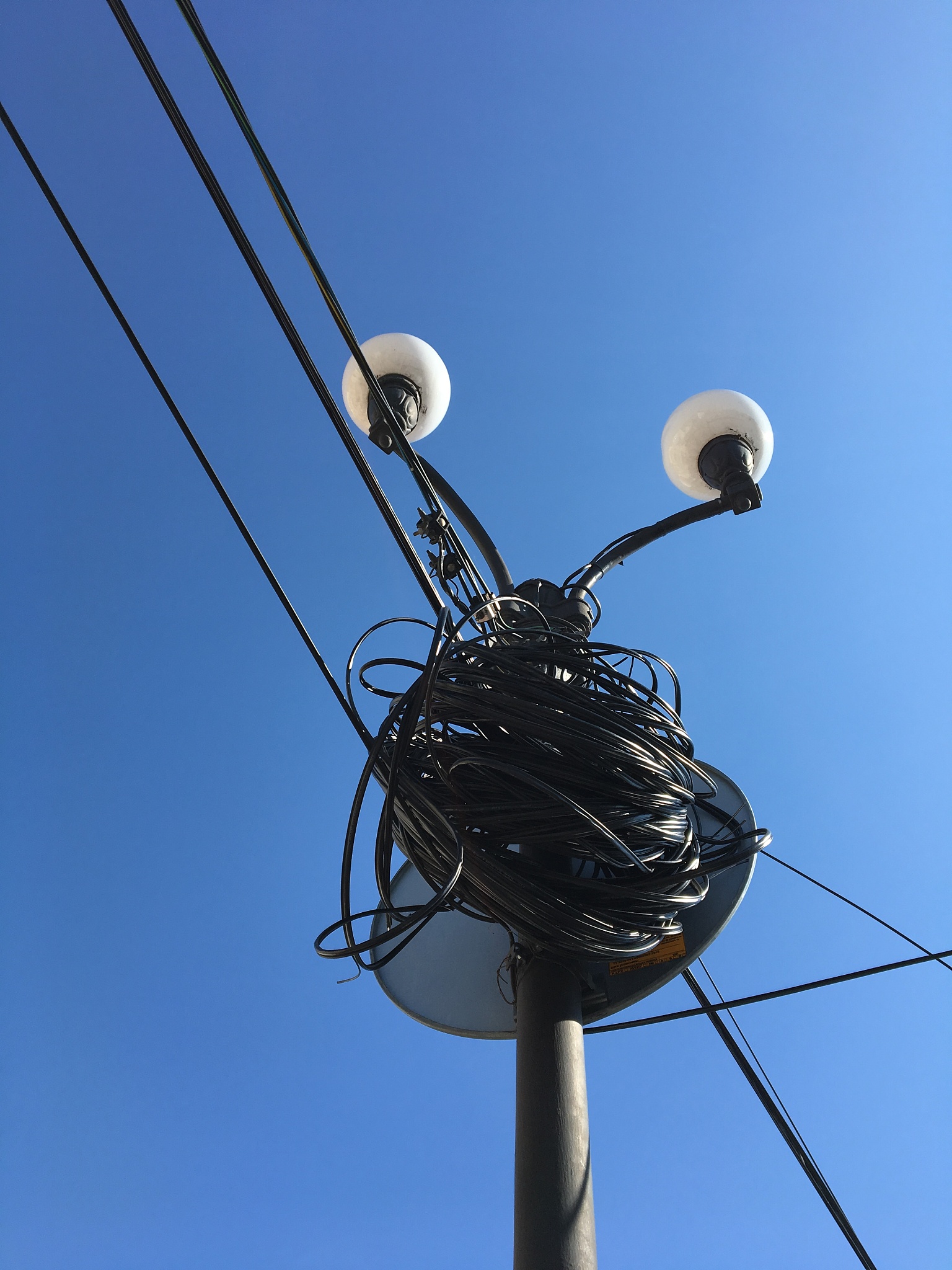 low angle view of street light against clear blue sky