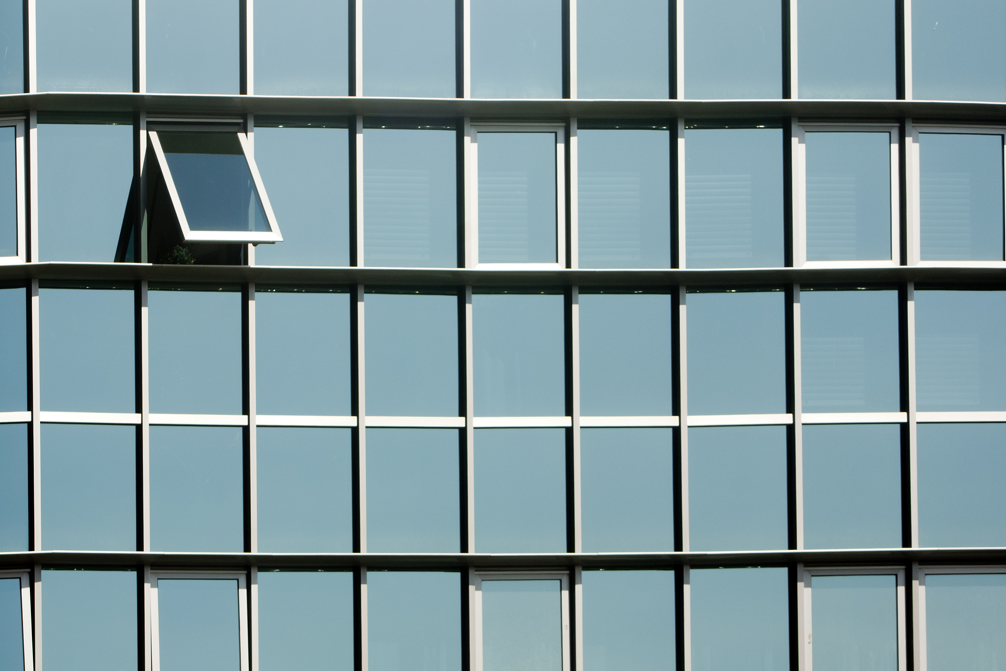 detail of glass facade, one window open.
