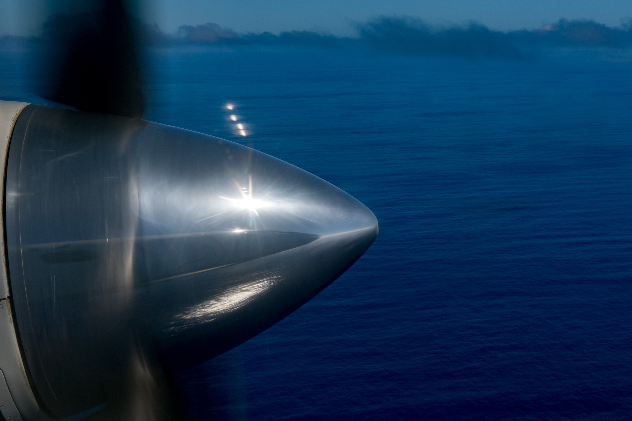 propeller airplane detail flying in tropical paradise