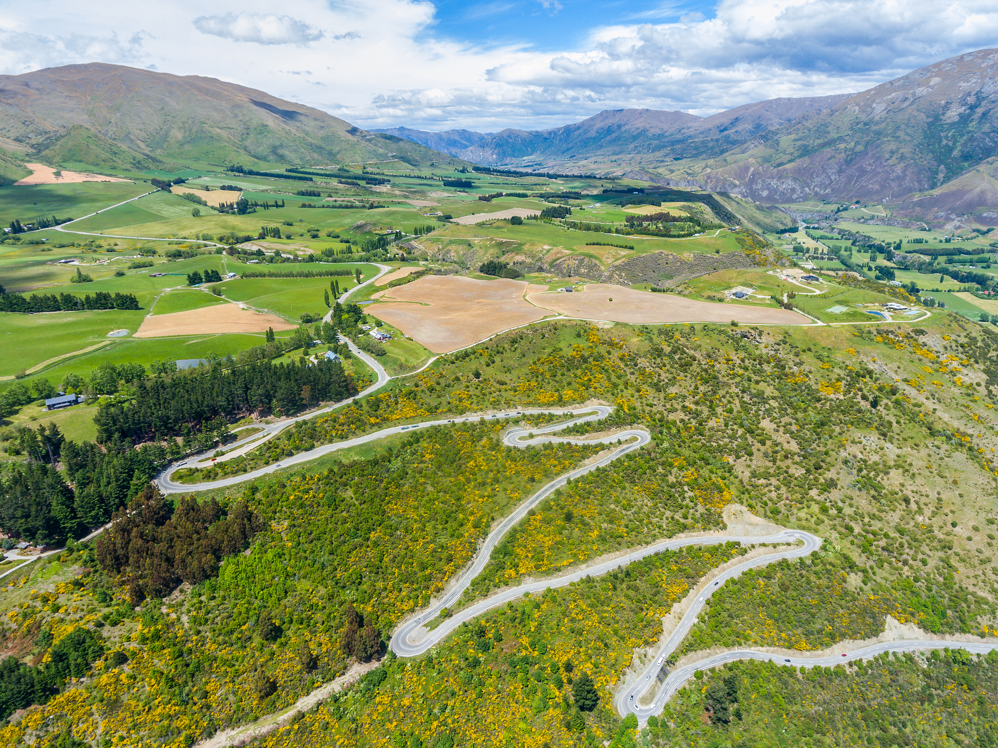 winding road on mountain, queenstown, new zealand