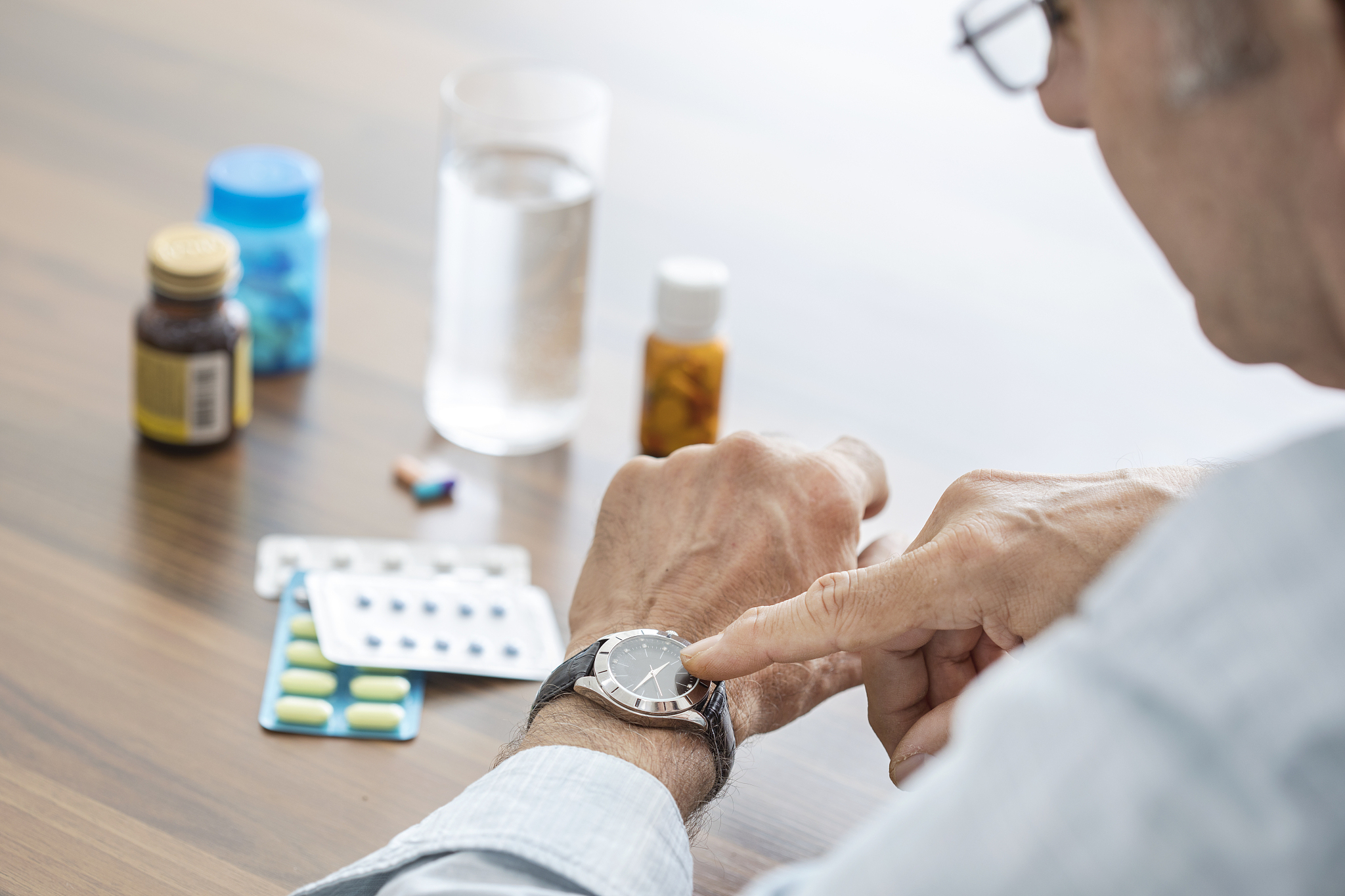 time to take pills for old man