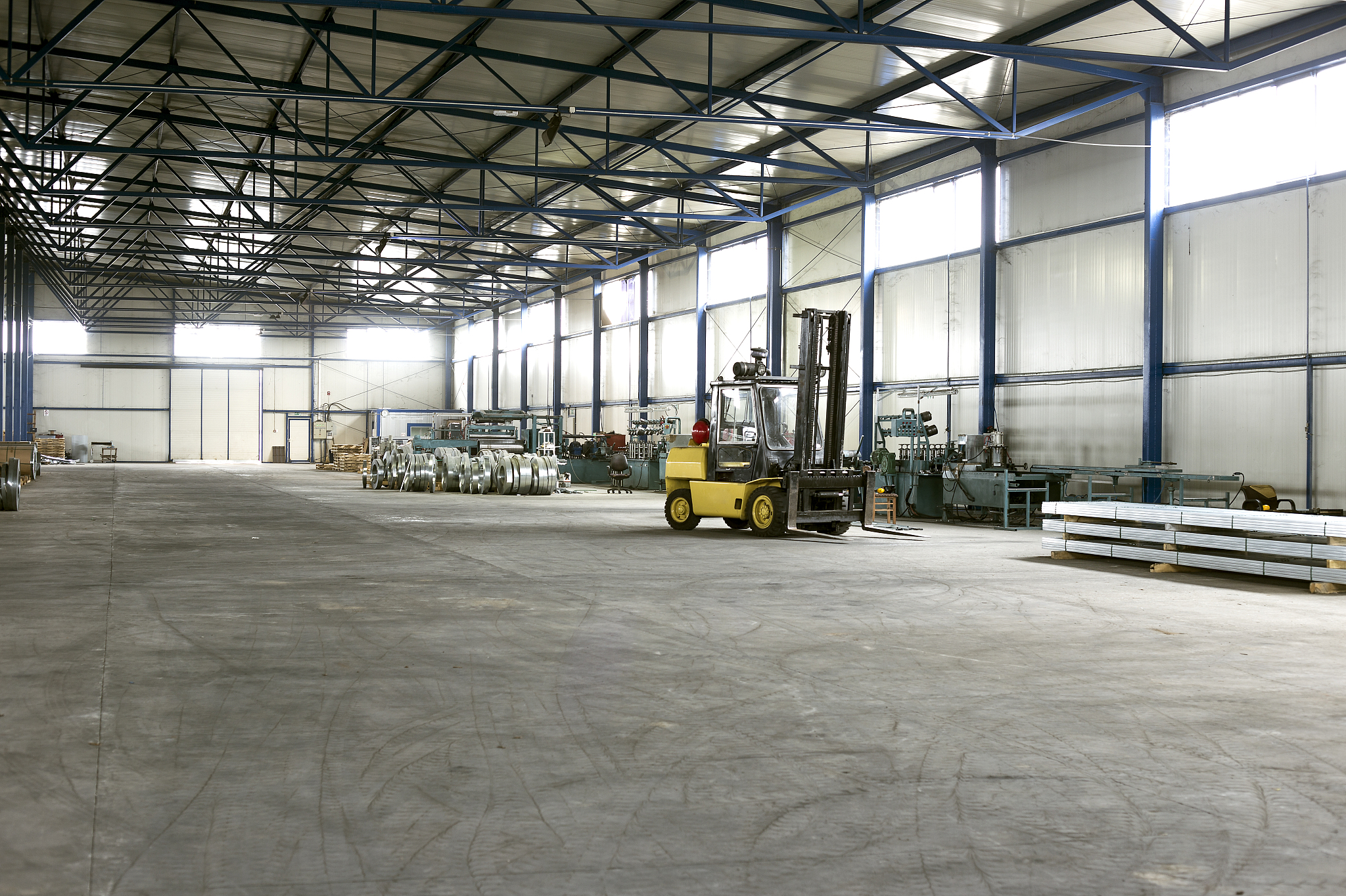 forklift in sheet metal production hall