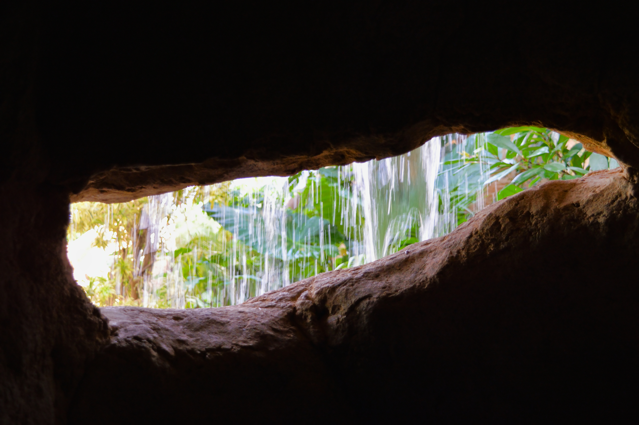 light and water through dark background