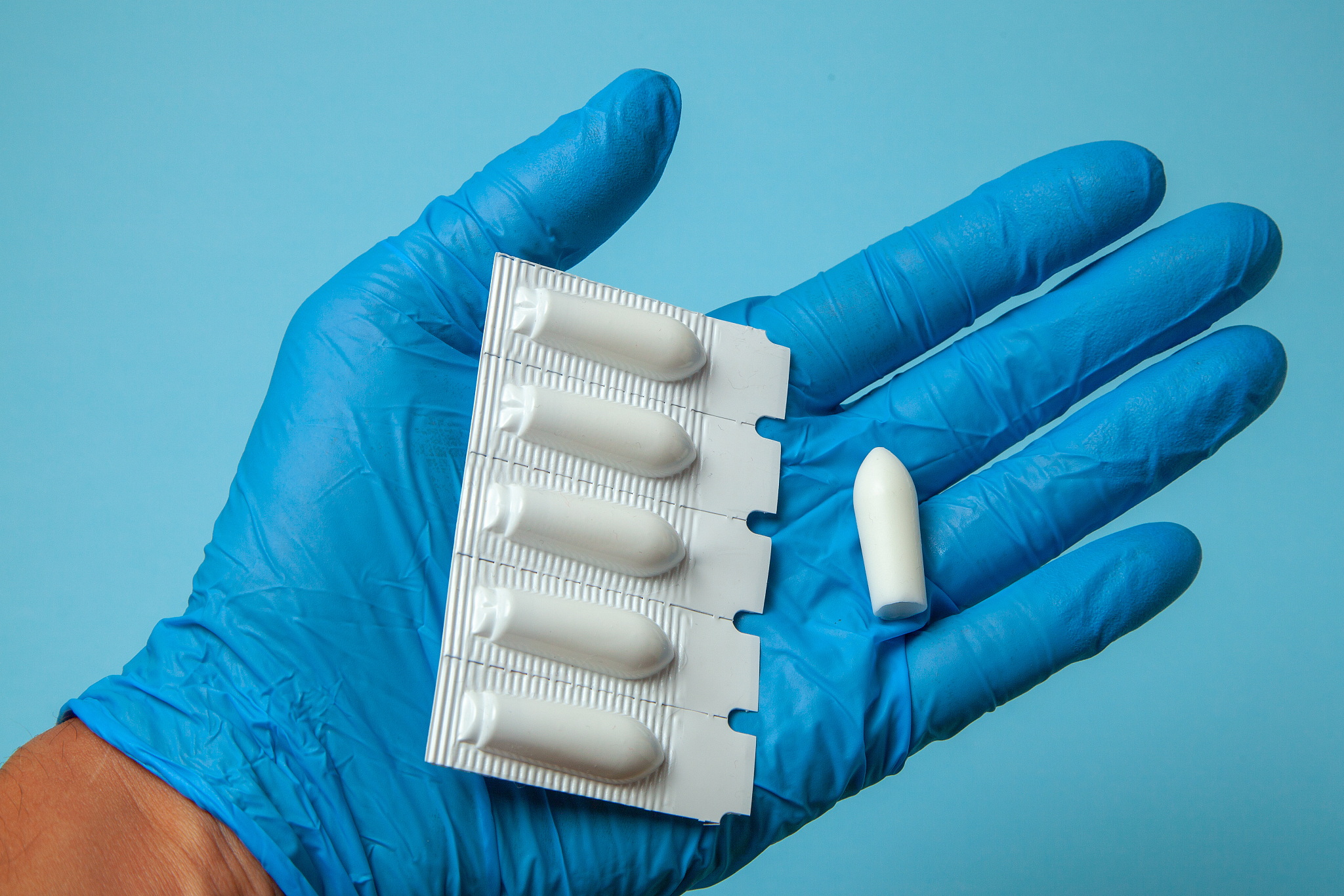 suppository for anal or vaginal use in the hands of doctor in gl