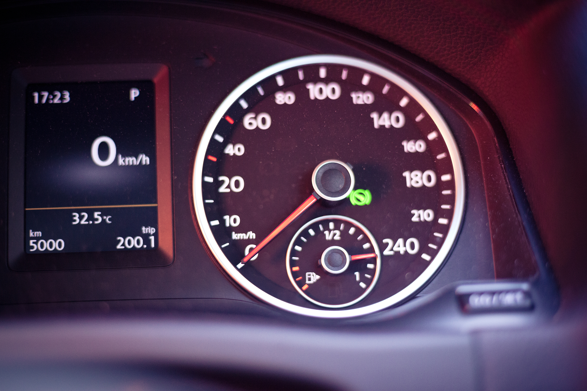 closeup of speedometer on car dashboard