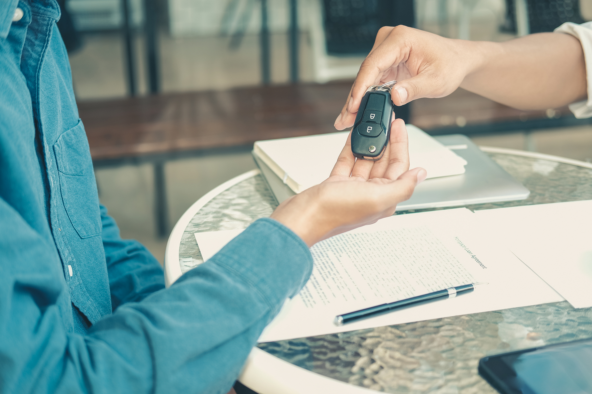 salesman dealer giving car key to new owner. car sale & dealersh