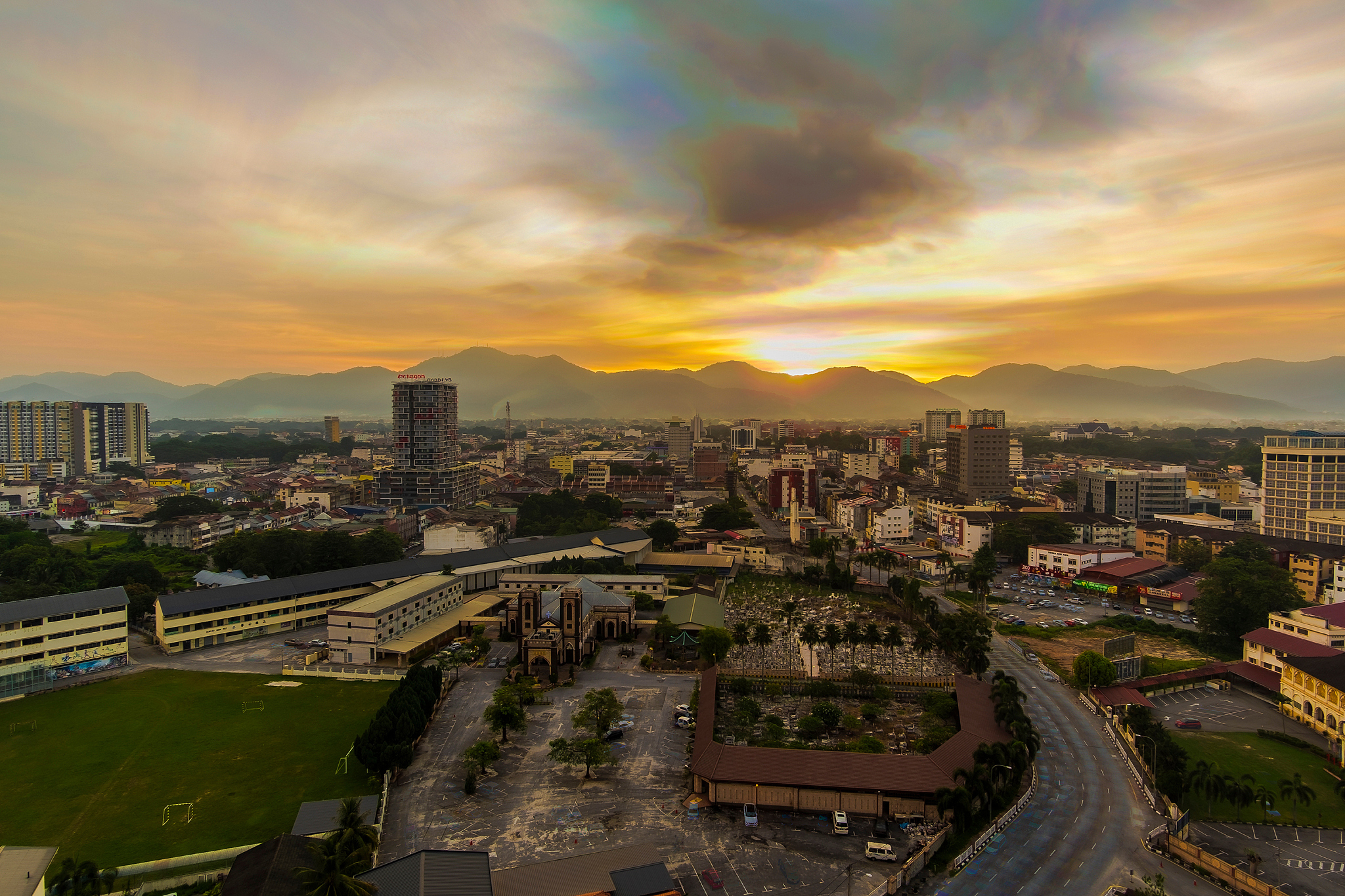 high angle view of buildings against sky during sunset
