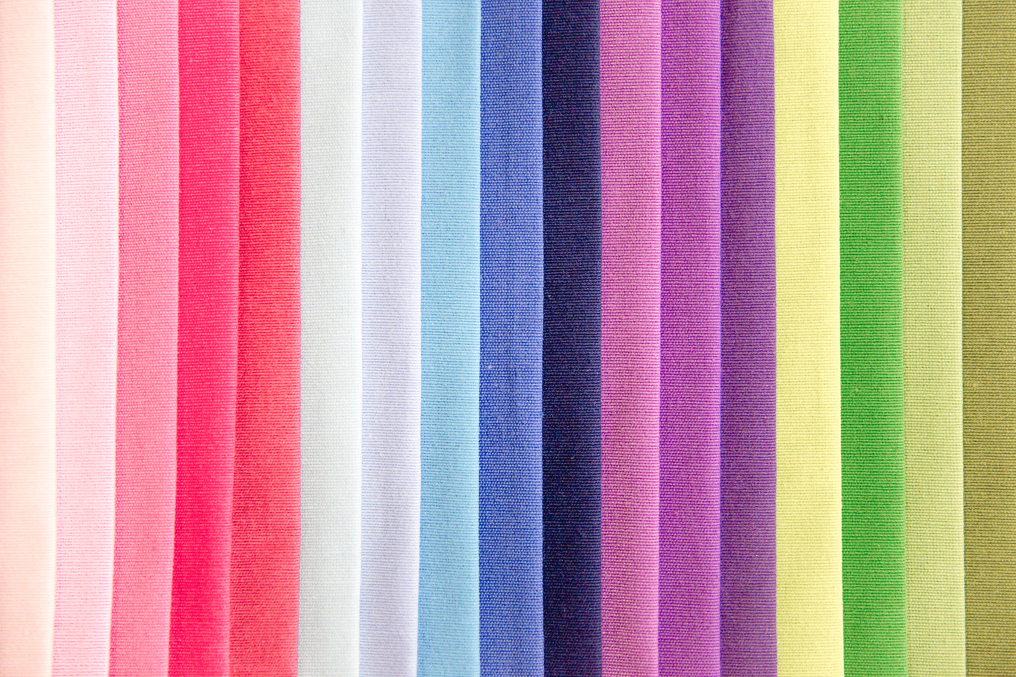 rolls of fabric and textiles in a shop or store