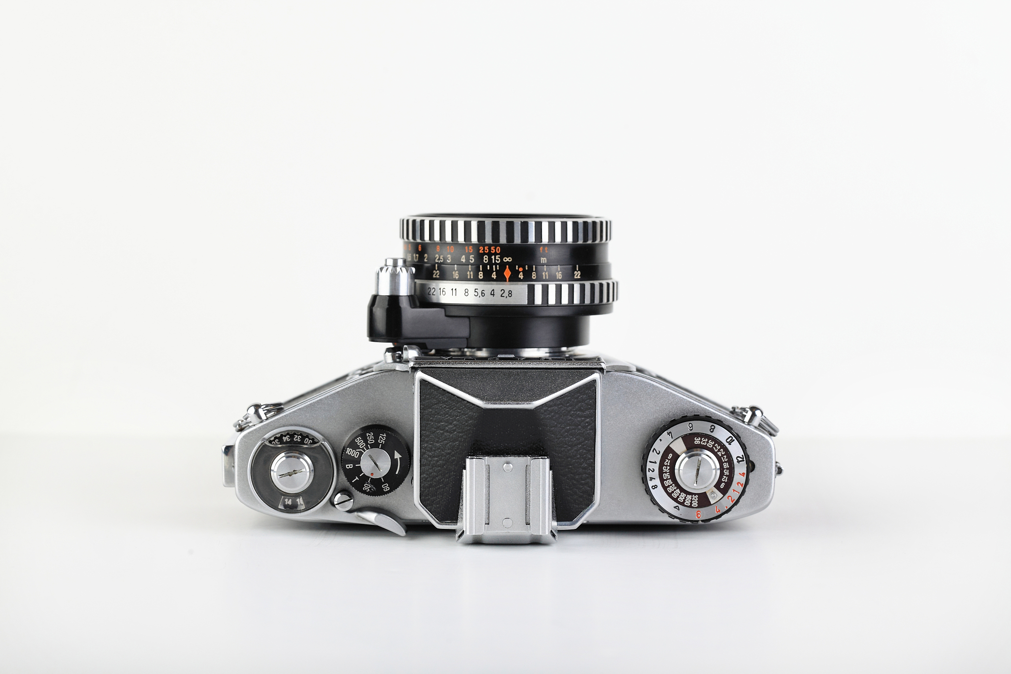 the old german 35 mm slr film camera with lens 50 mm lens on a w