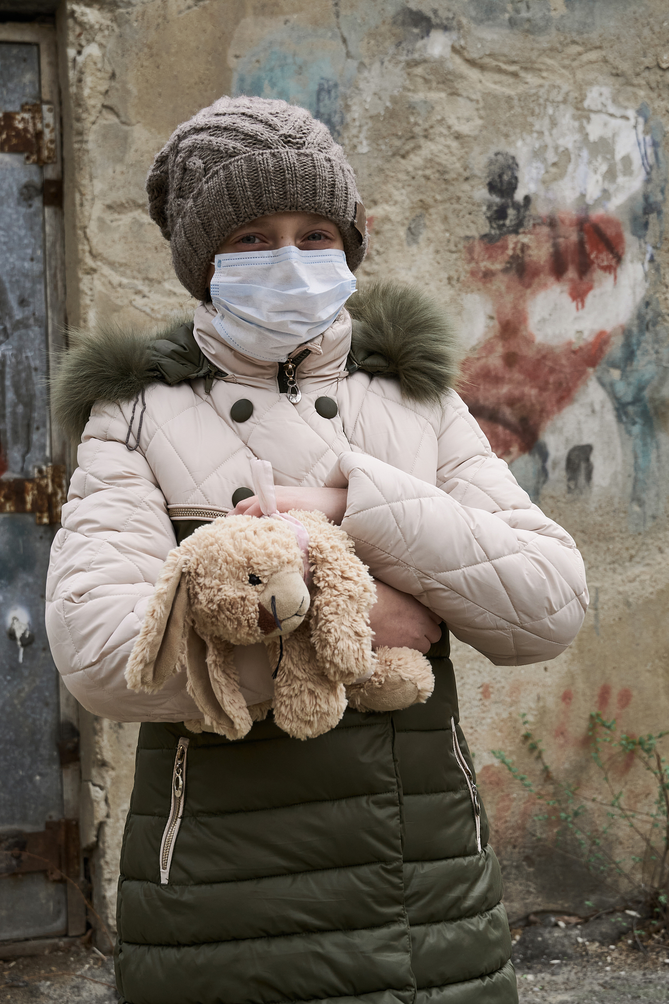 concept of epidemic and quarantine - a girl with a face mask and