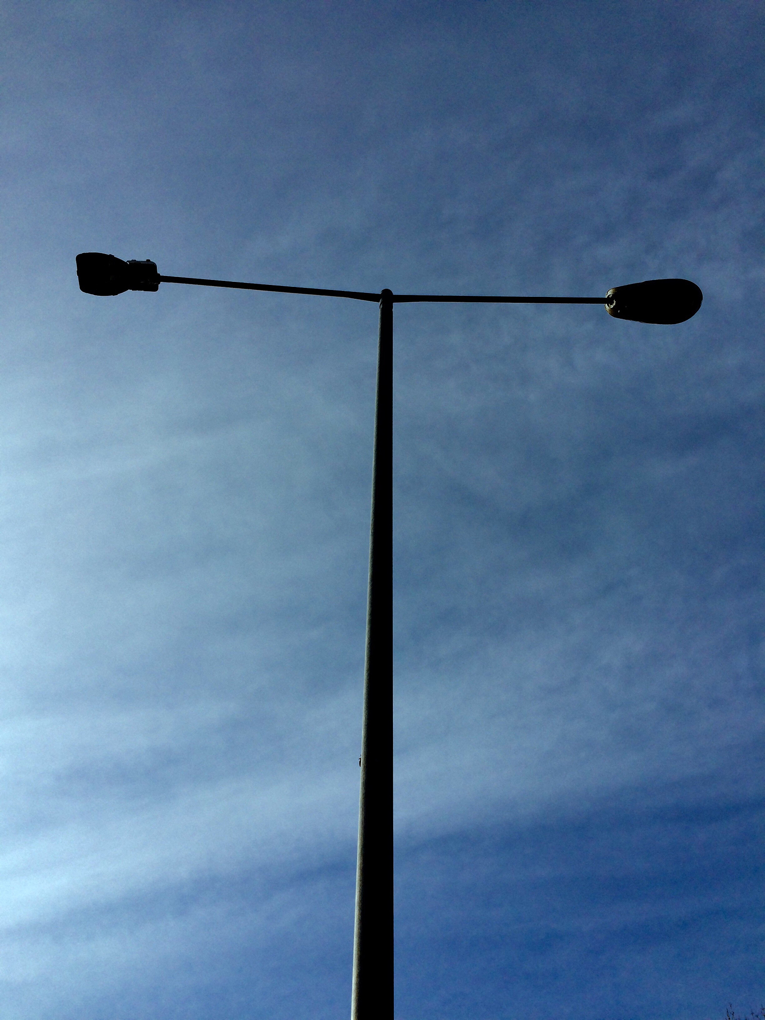 low angle view of street light against blue sky
