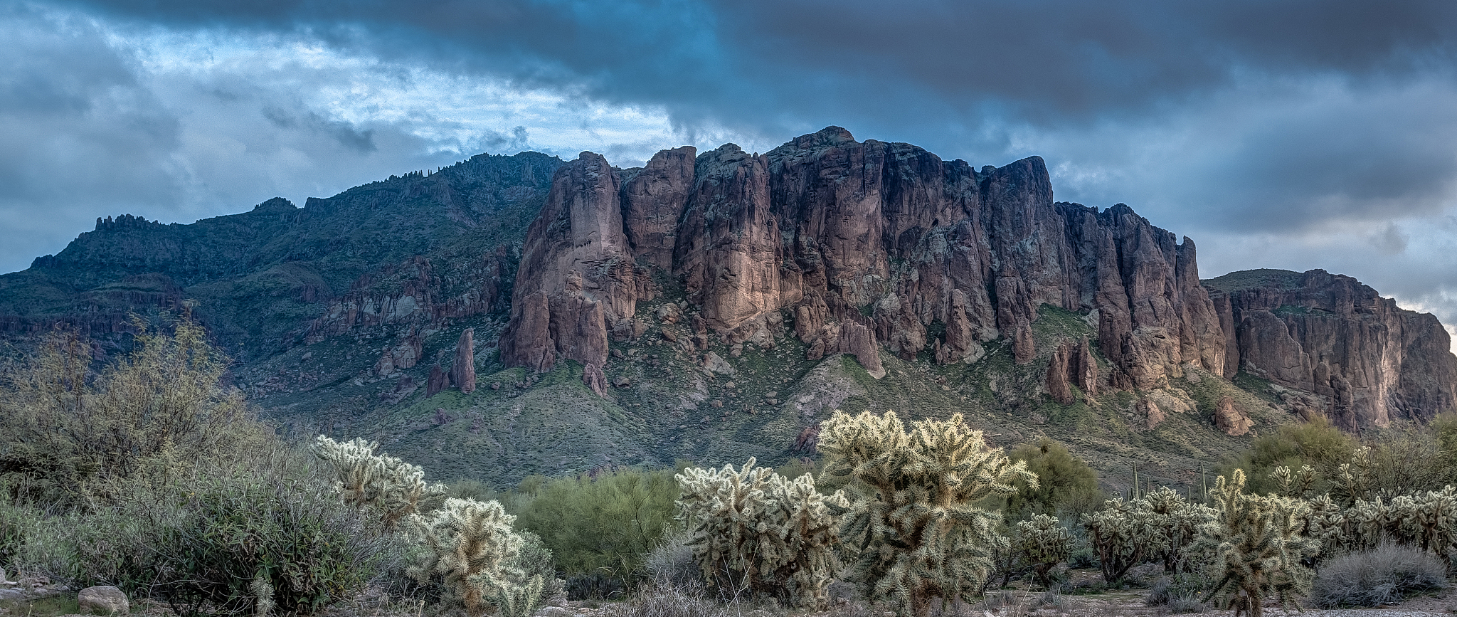 sun sets on the superstition mountains