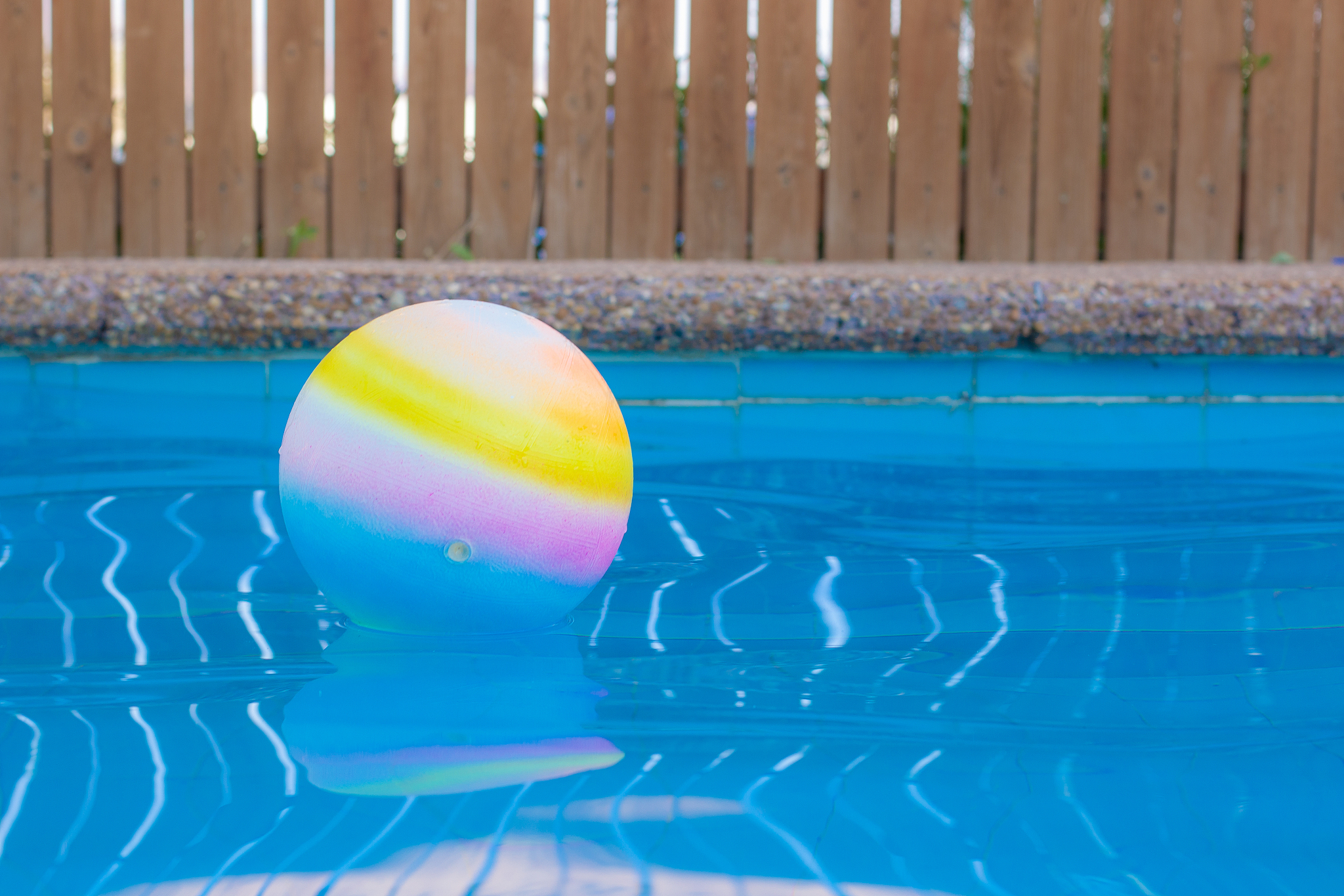 swimming pool side float ball on water surface soft focus pictur