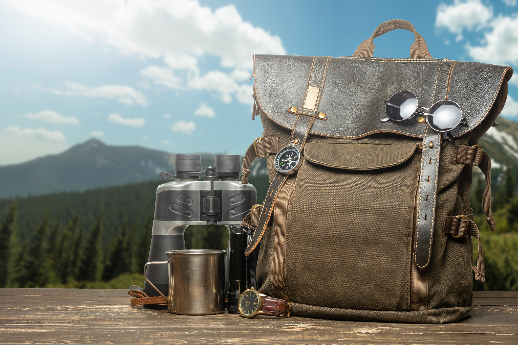 vintage backpack, hiking mug, clock and binoculars. tourism, tra