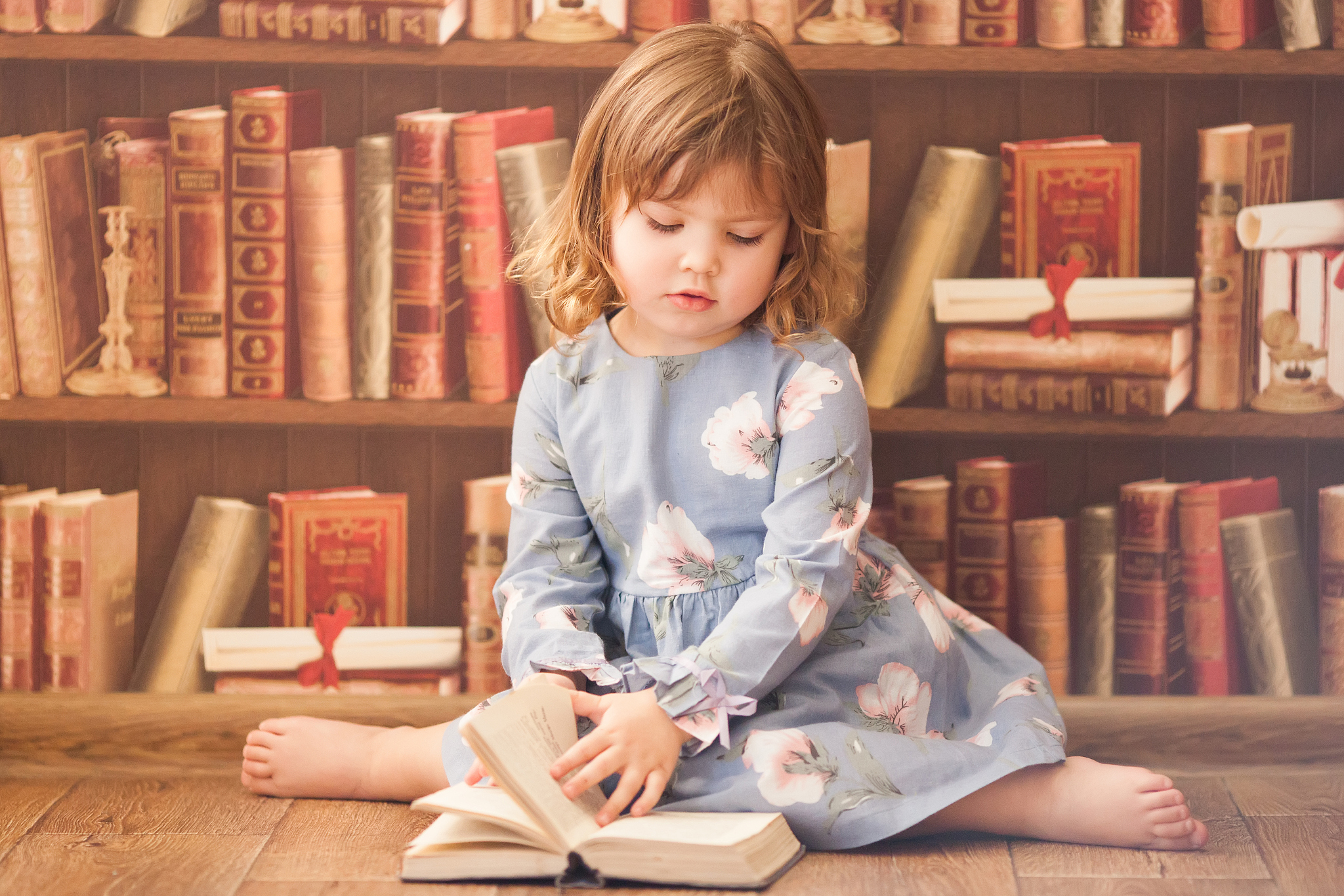 adorable little bookworm girl reading books