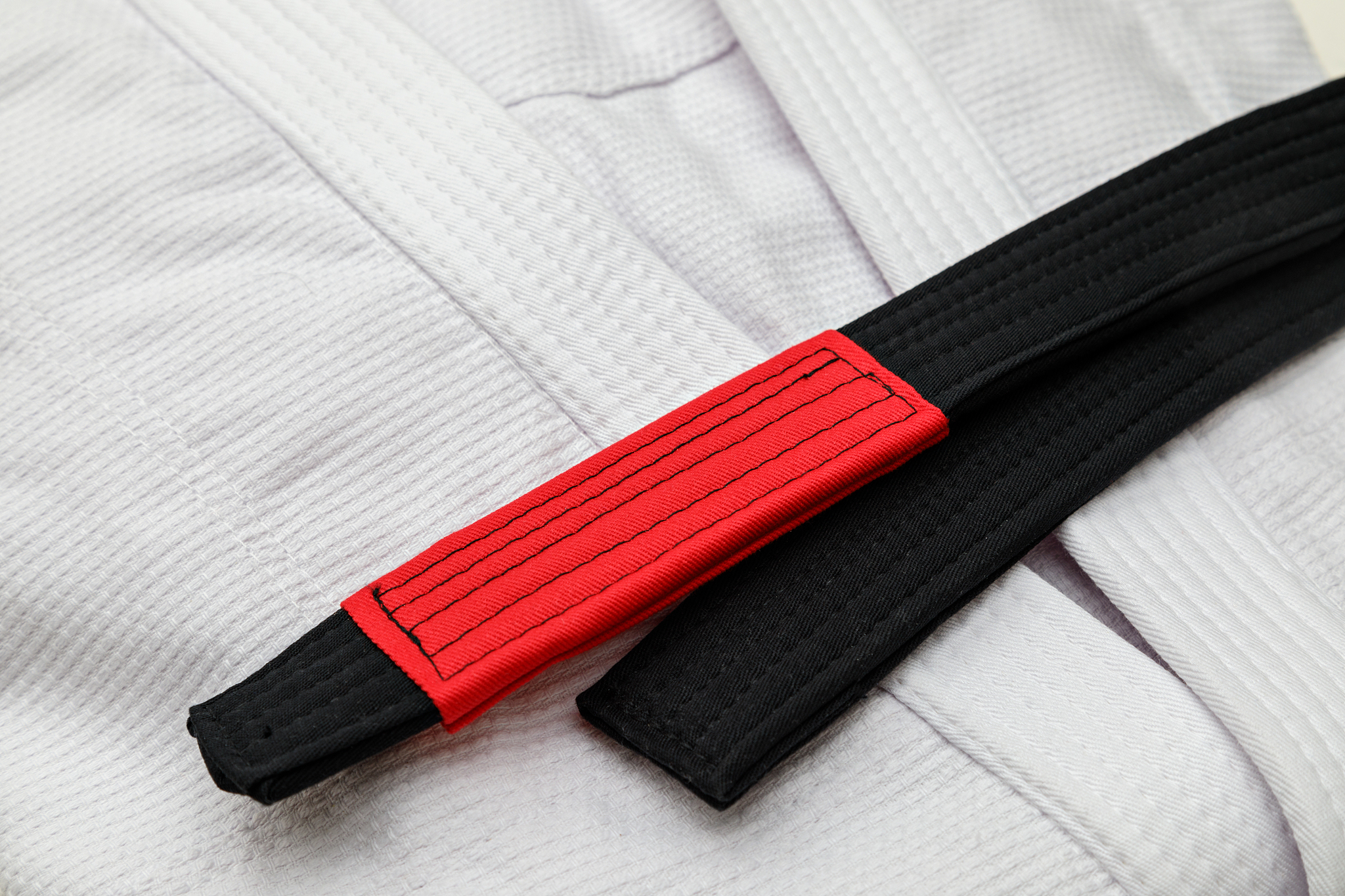 white kimono with black belt