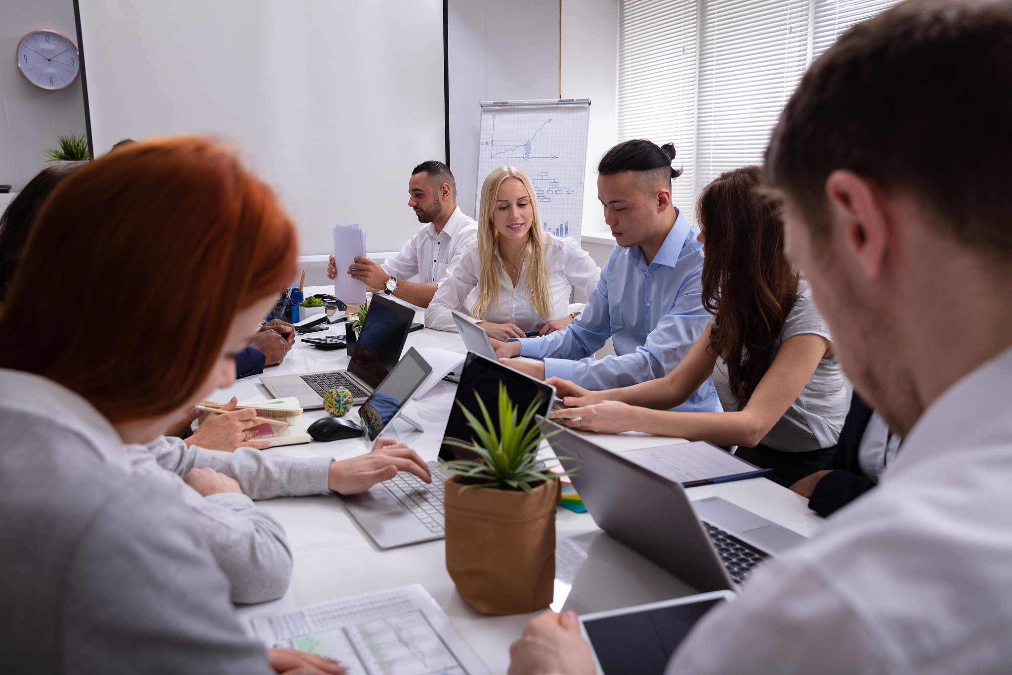 group of business people sitting together in the meeting