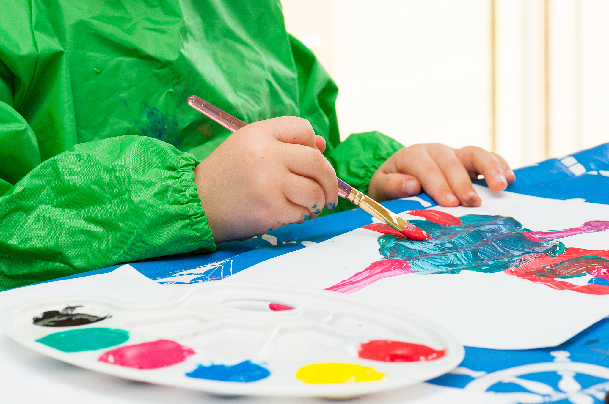 child painting with brush