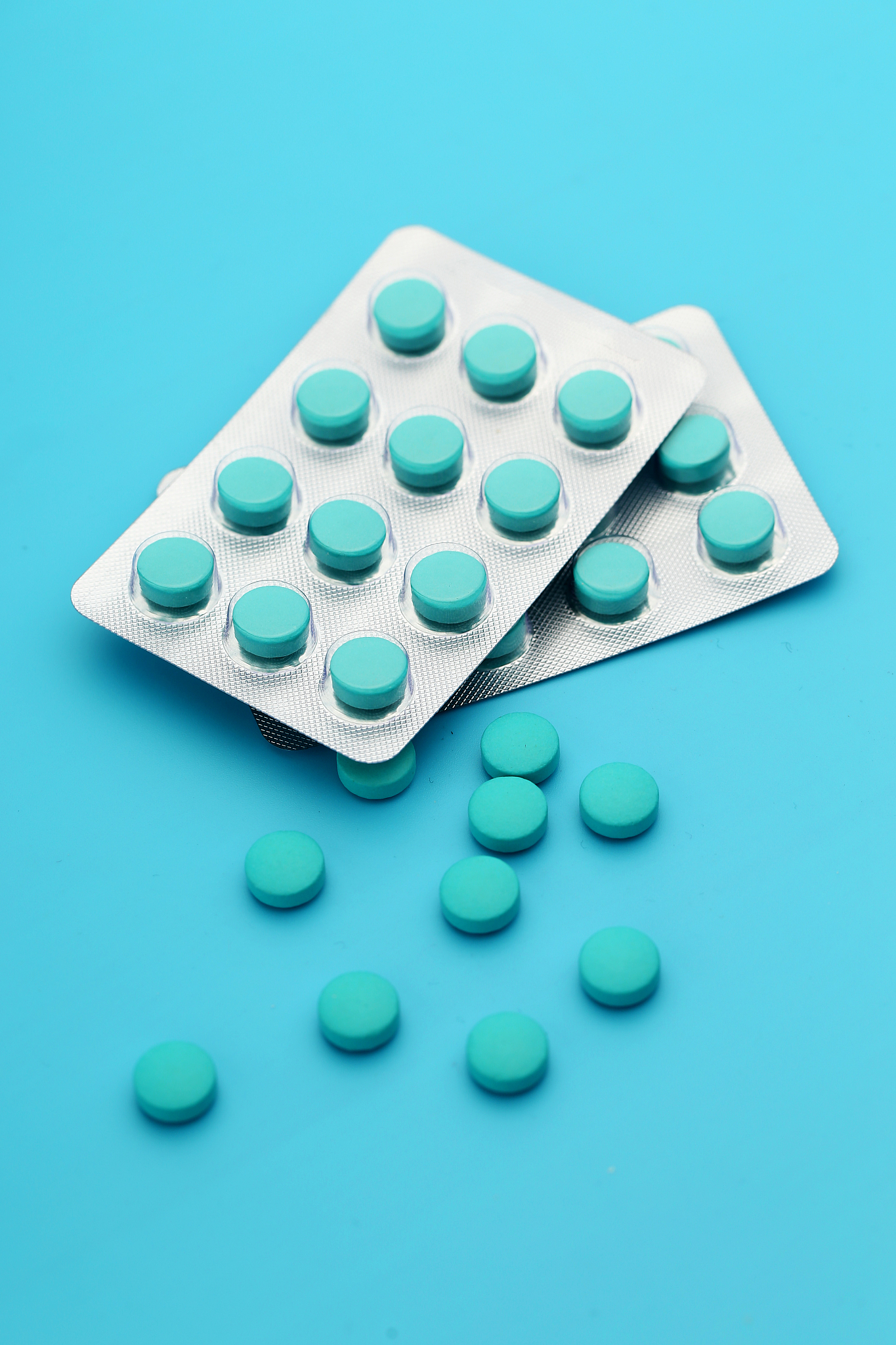 blue tablets on blue background
