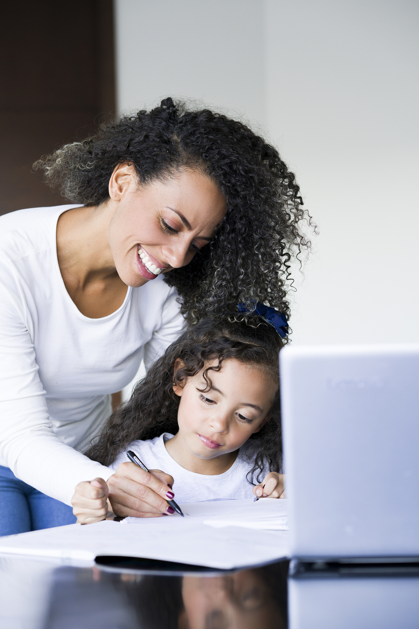 mom and daughter doing homework