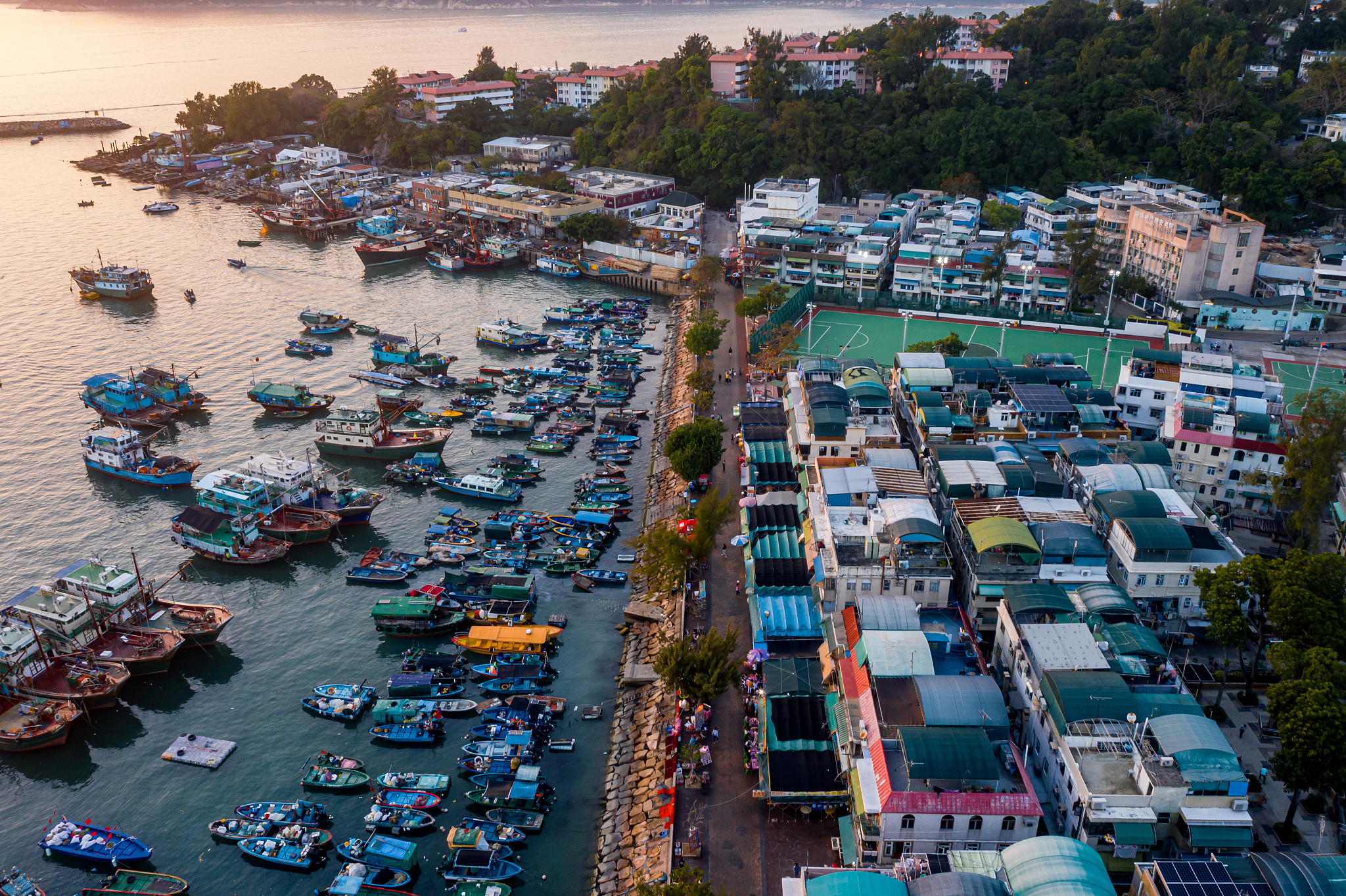 sunset at cheung chau island with boats