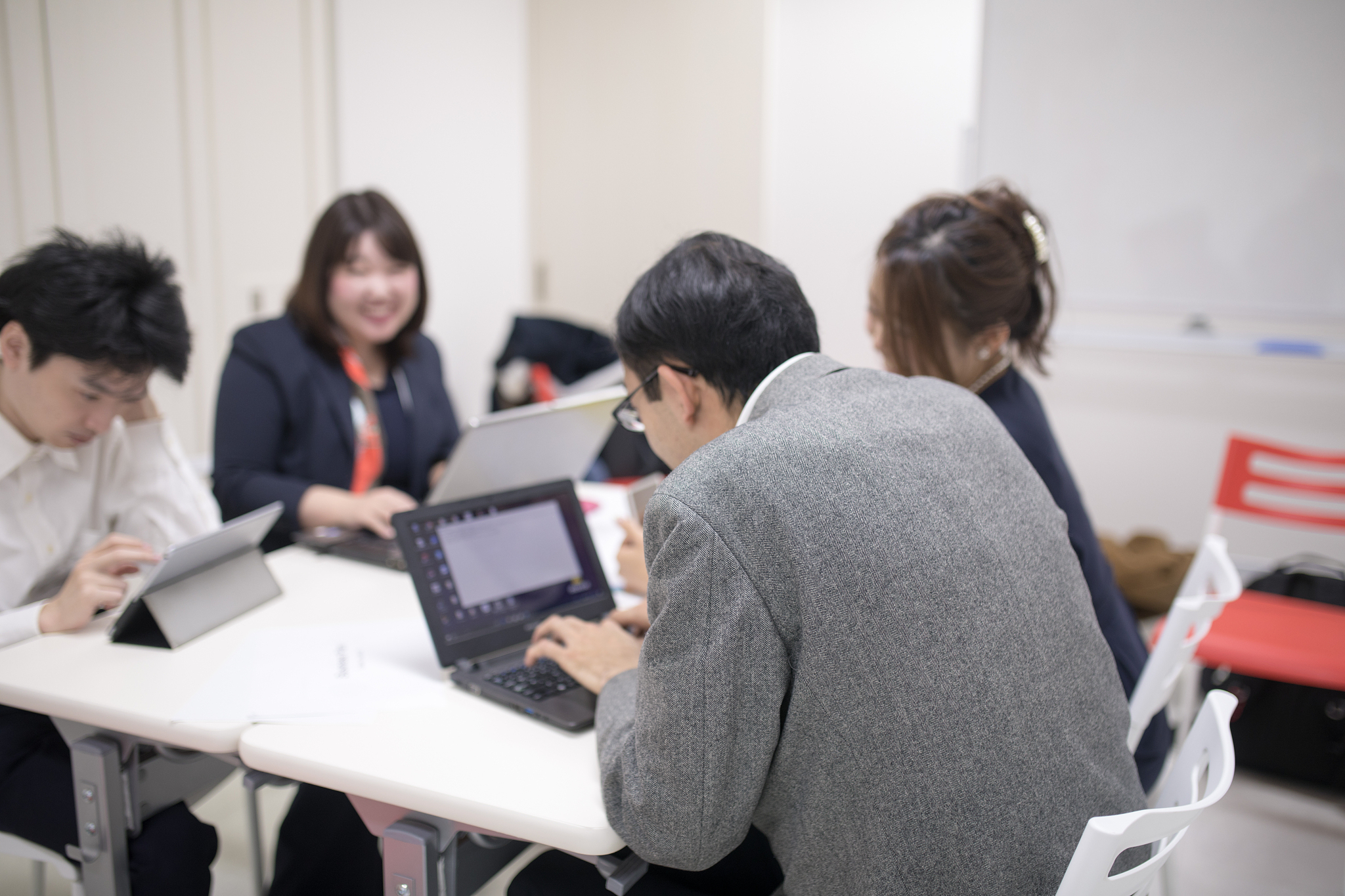 japanese business people having meeting in board room