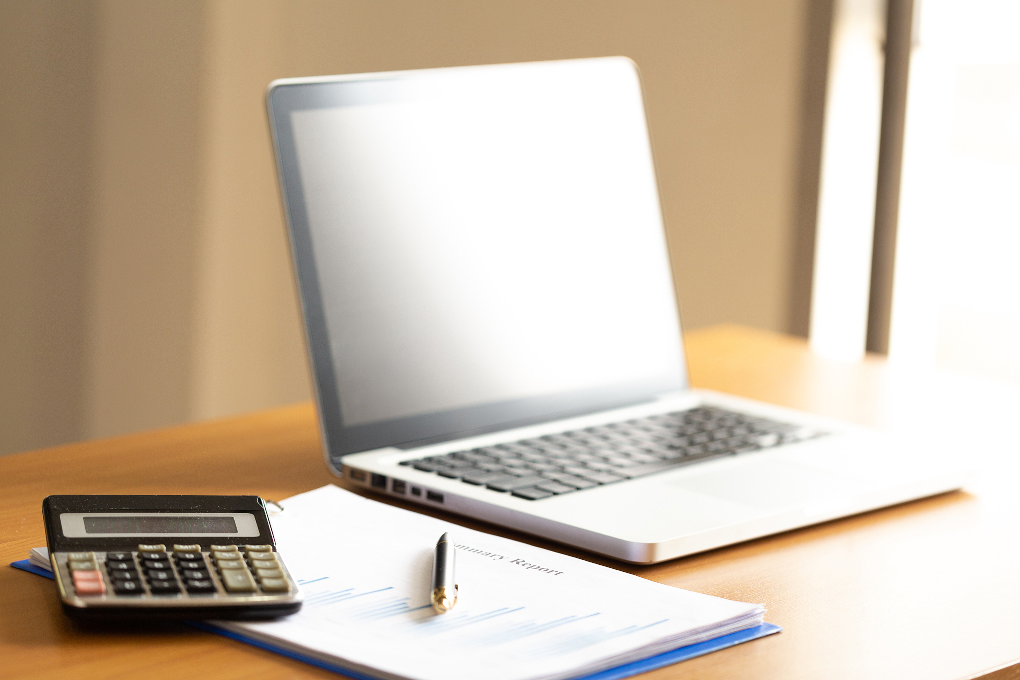 computer laptop with graph chart on worktable.