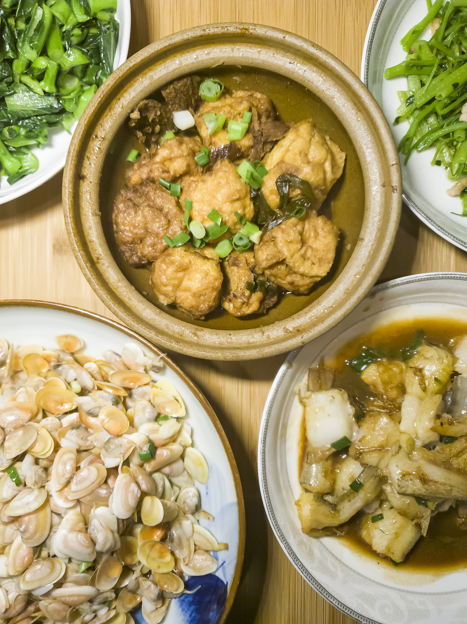 an ordinary dinner for a chinese family, with seafood and vegeta