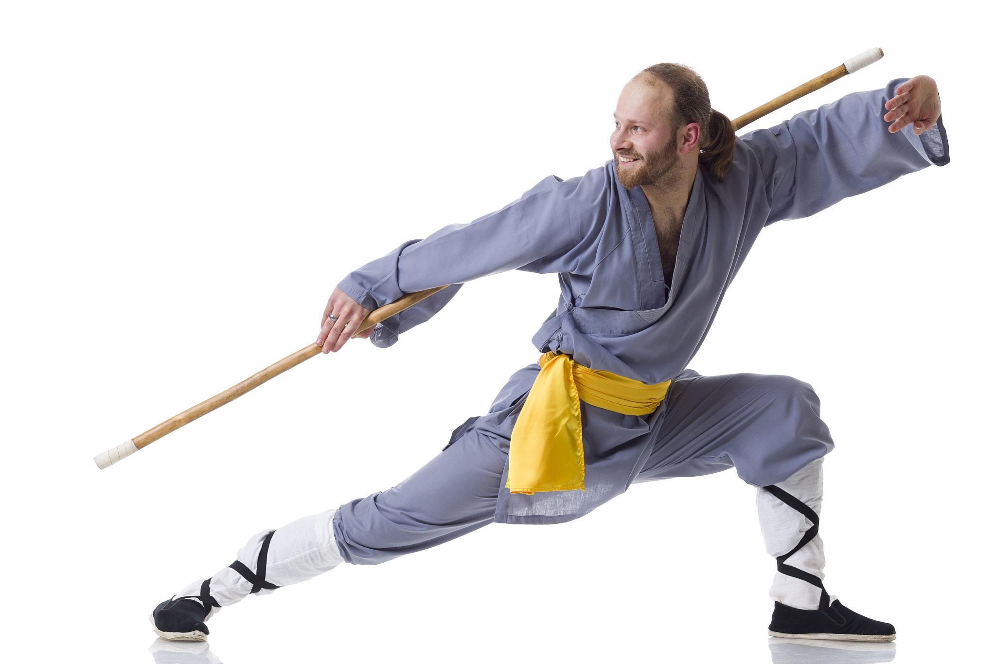 kung fu fighting position with wushu cudgel isolated on white
