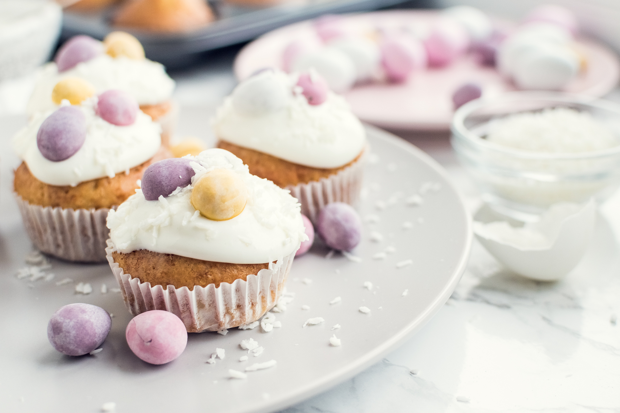 glazed easter cupcakes decorated with mini chocolate eggs