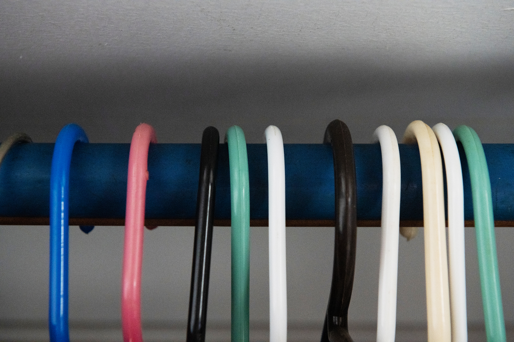 close up of plastic hangers inside a closet
