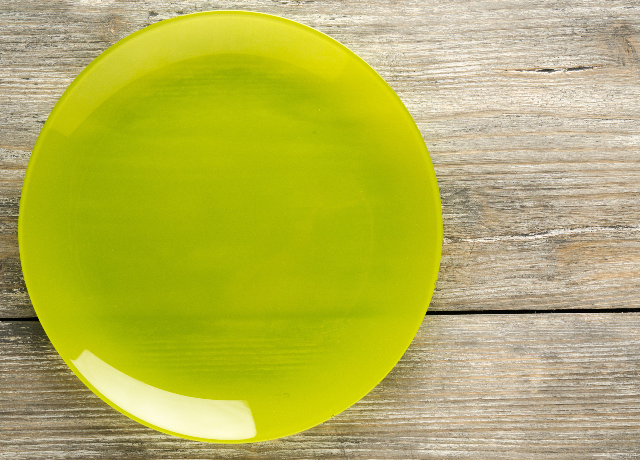 plate on a wooden background. plate top view. copy space