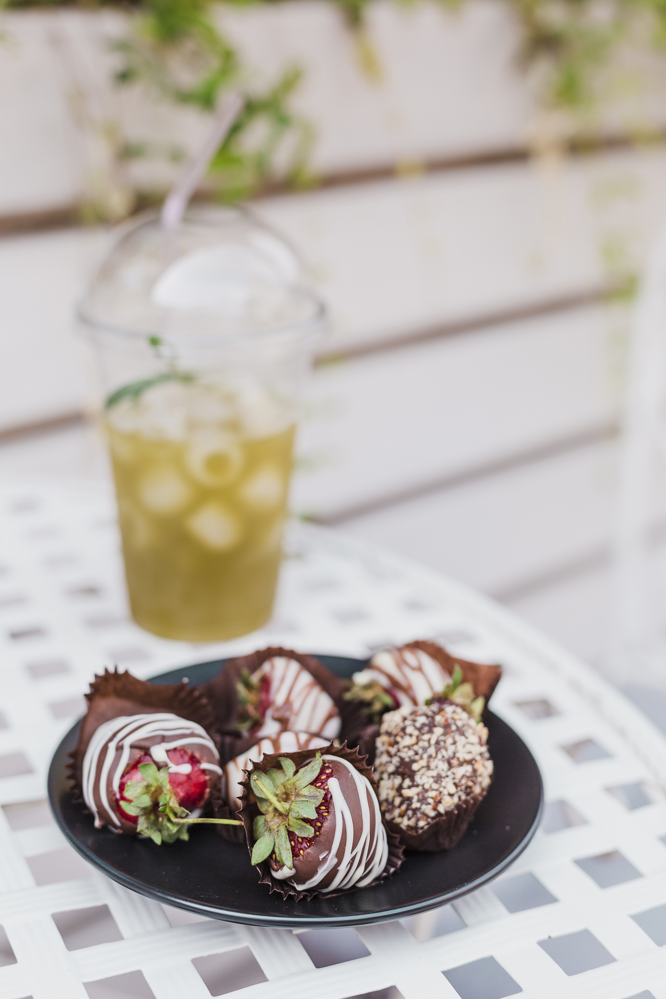 handmade chocolate-covered strawberries on a plate in a summer c
