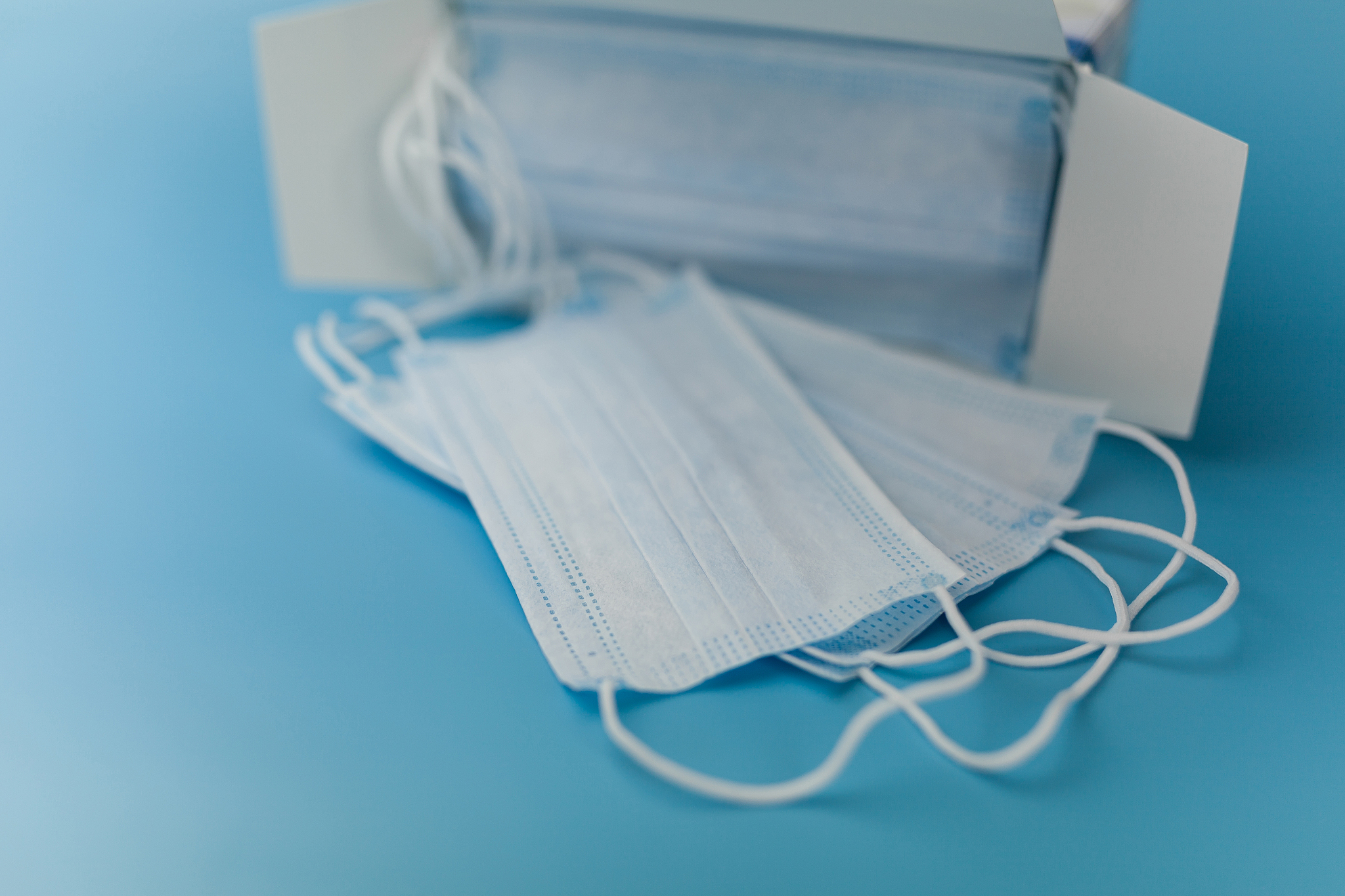 medical respiratory bandage face on blue background. prevention 
