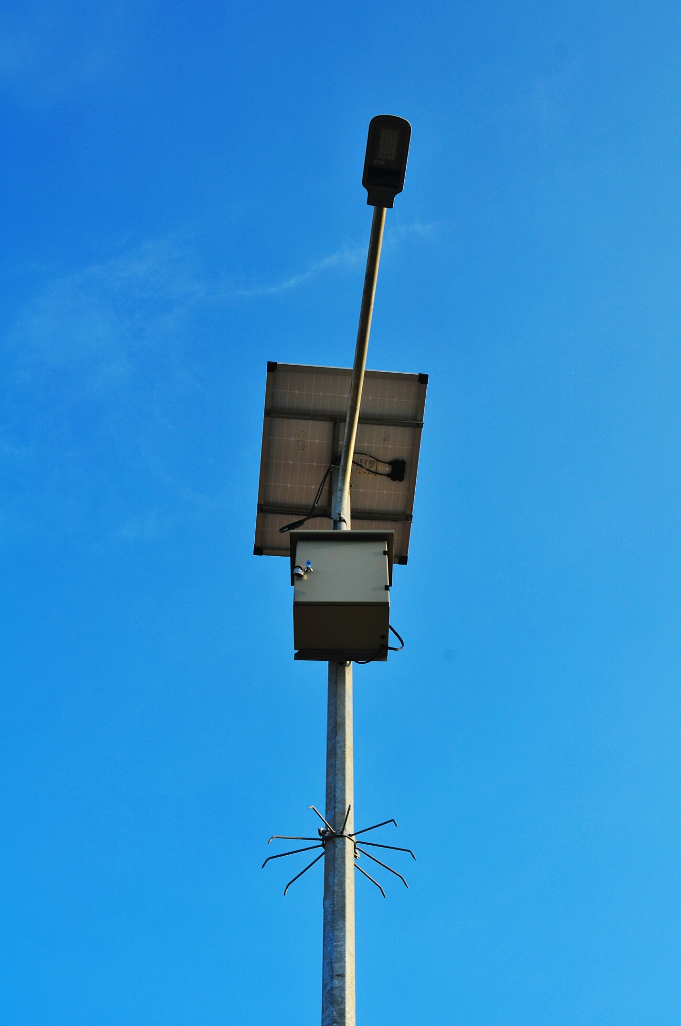 low angle view of street light against blue sky