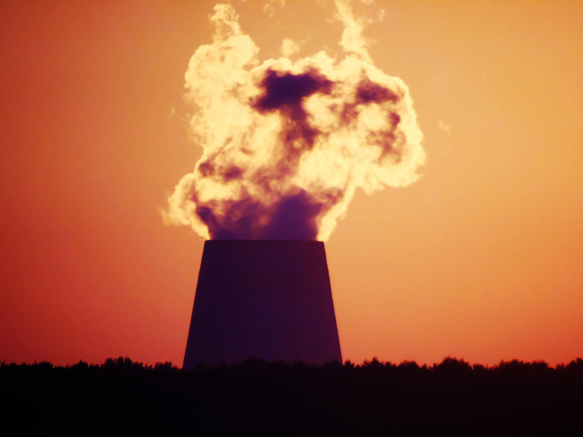 cooling towers of nuclear power plant during sunset