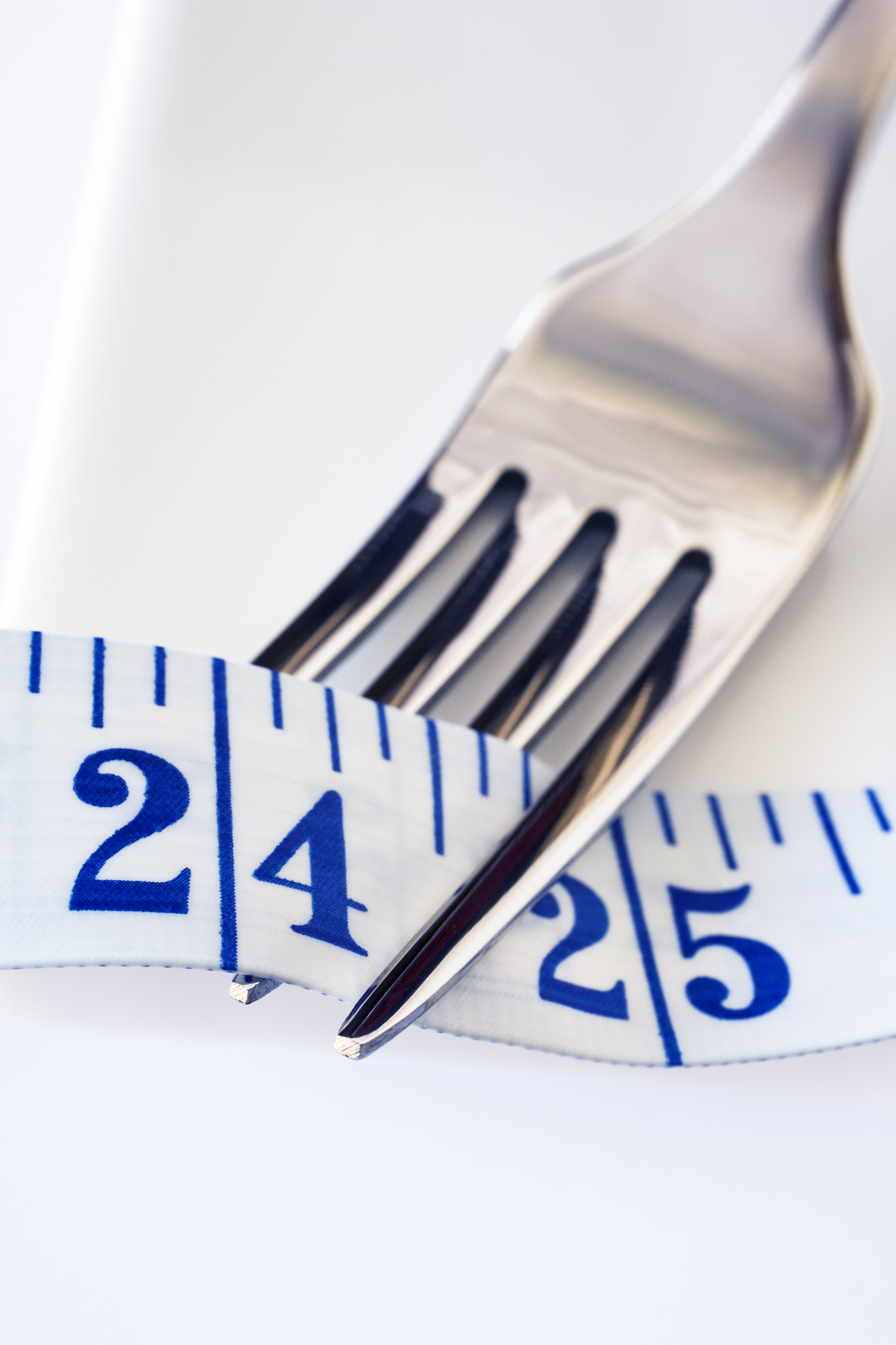 fork and tape measure showing 24 inches