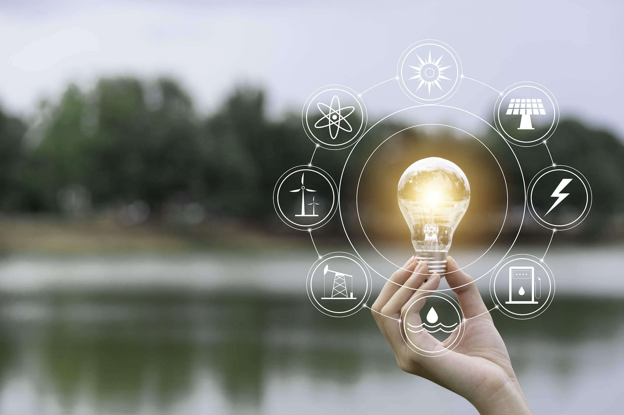 innovation and energy concept of hand hold a light bulb and copy