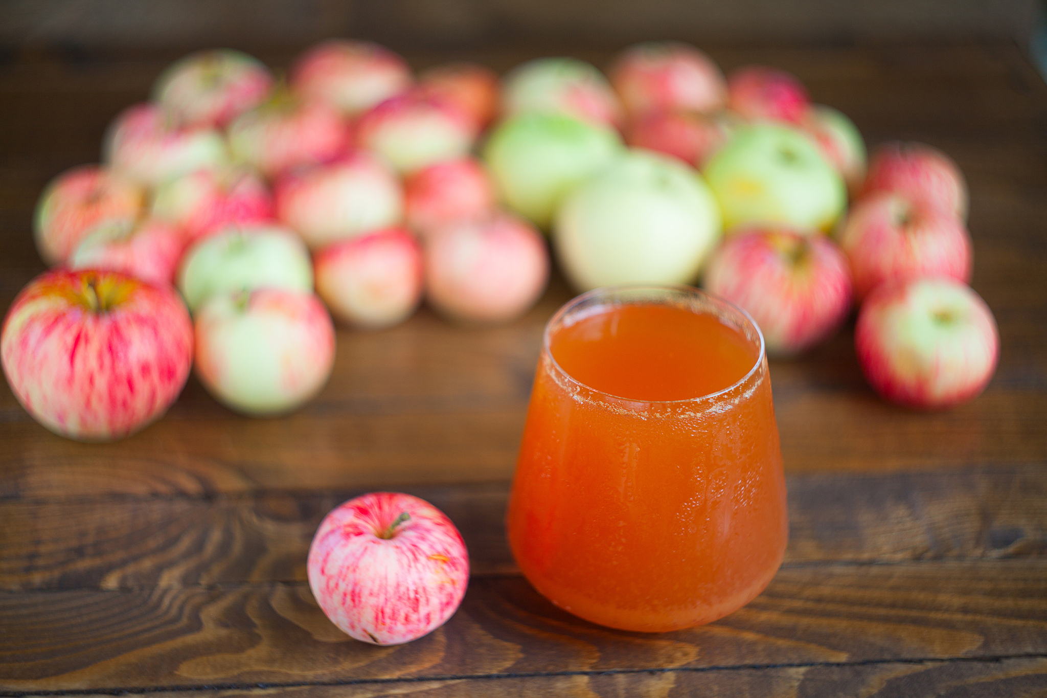delicious fresh squeezed apple juice in  transparent glass