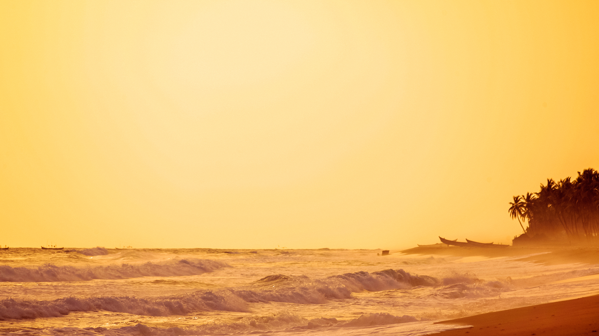 african beach at dusk - ouidah, benin
