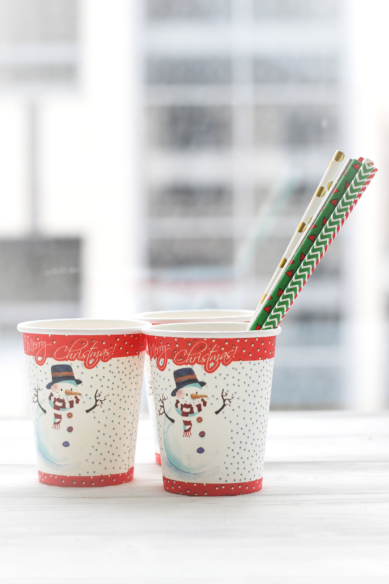 festive still life: three glasses with a picture of a snowman