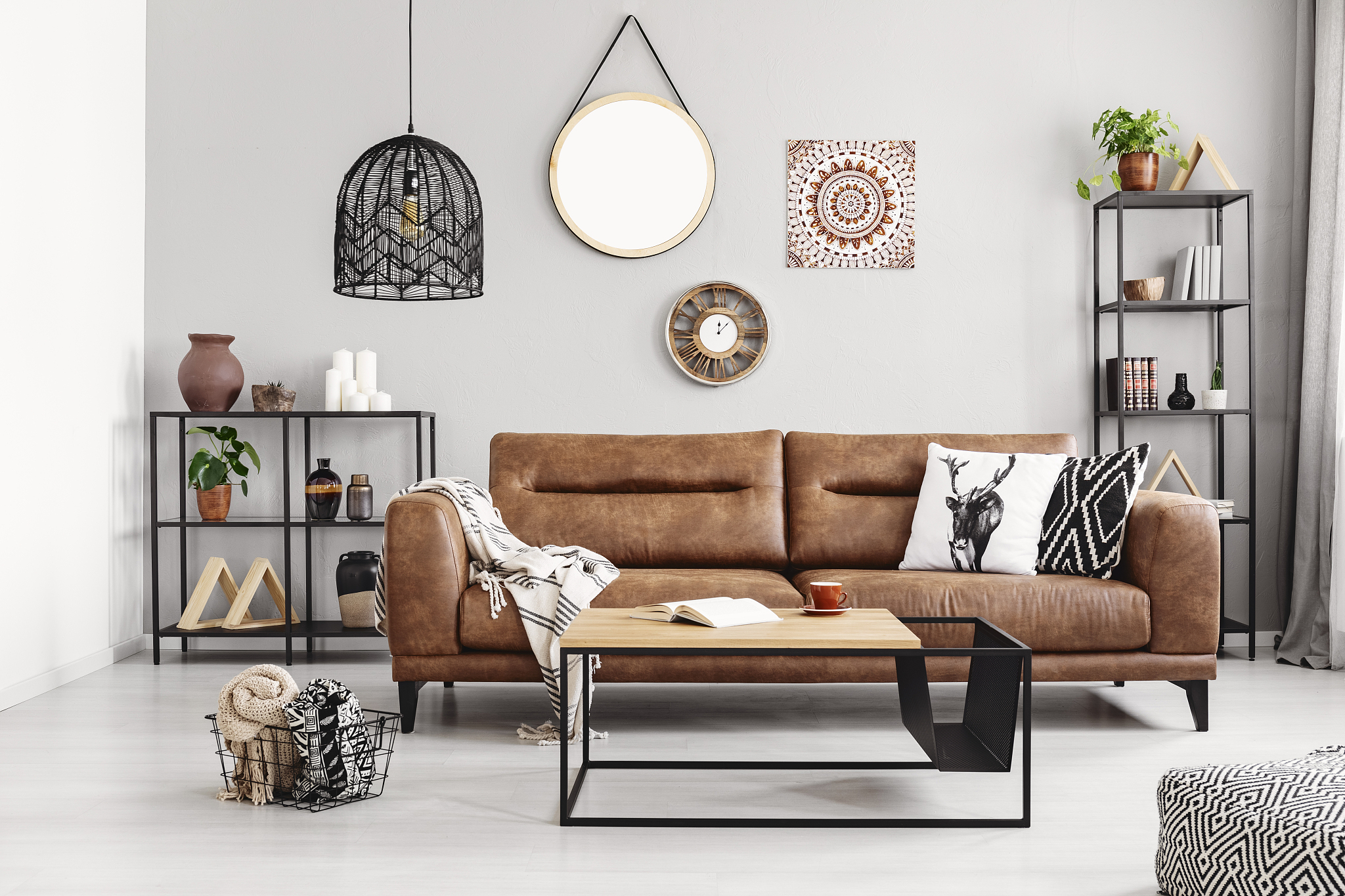 leather sofa with pillows and blanket in the middle of elegant l