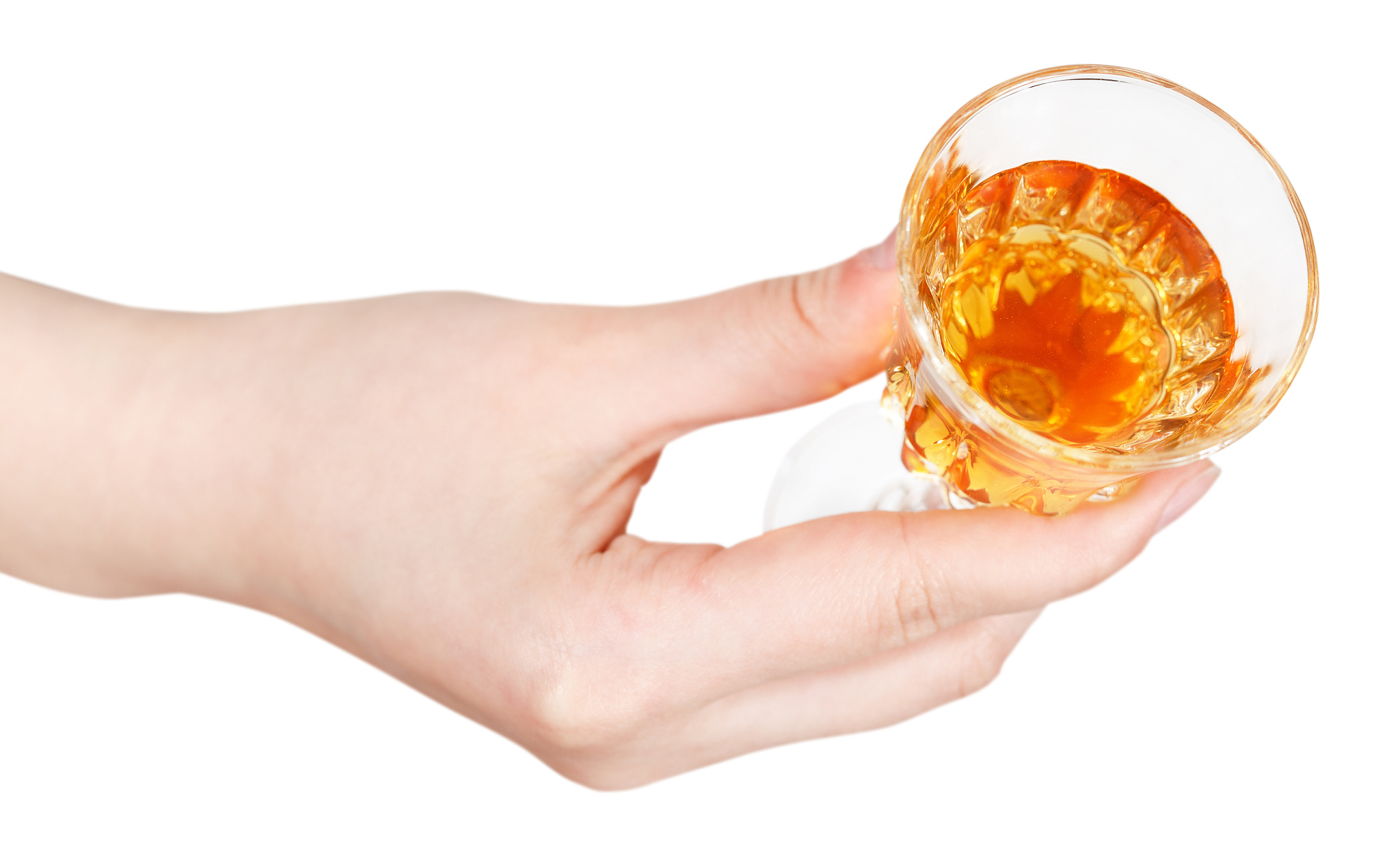 top view of hand holding glass of dessert wine