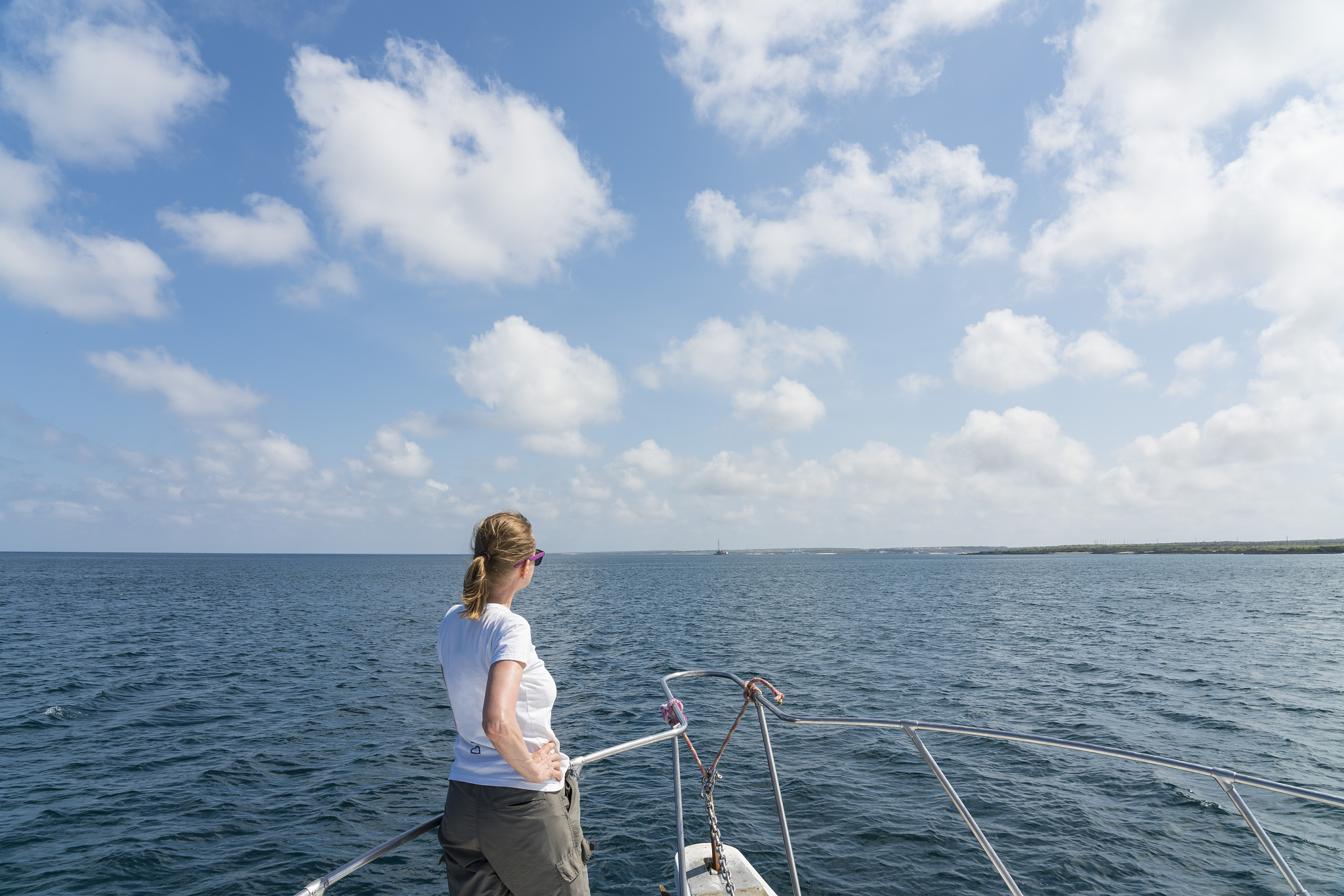 mature woman standing on the boat