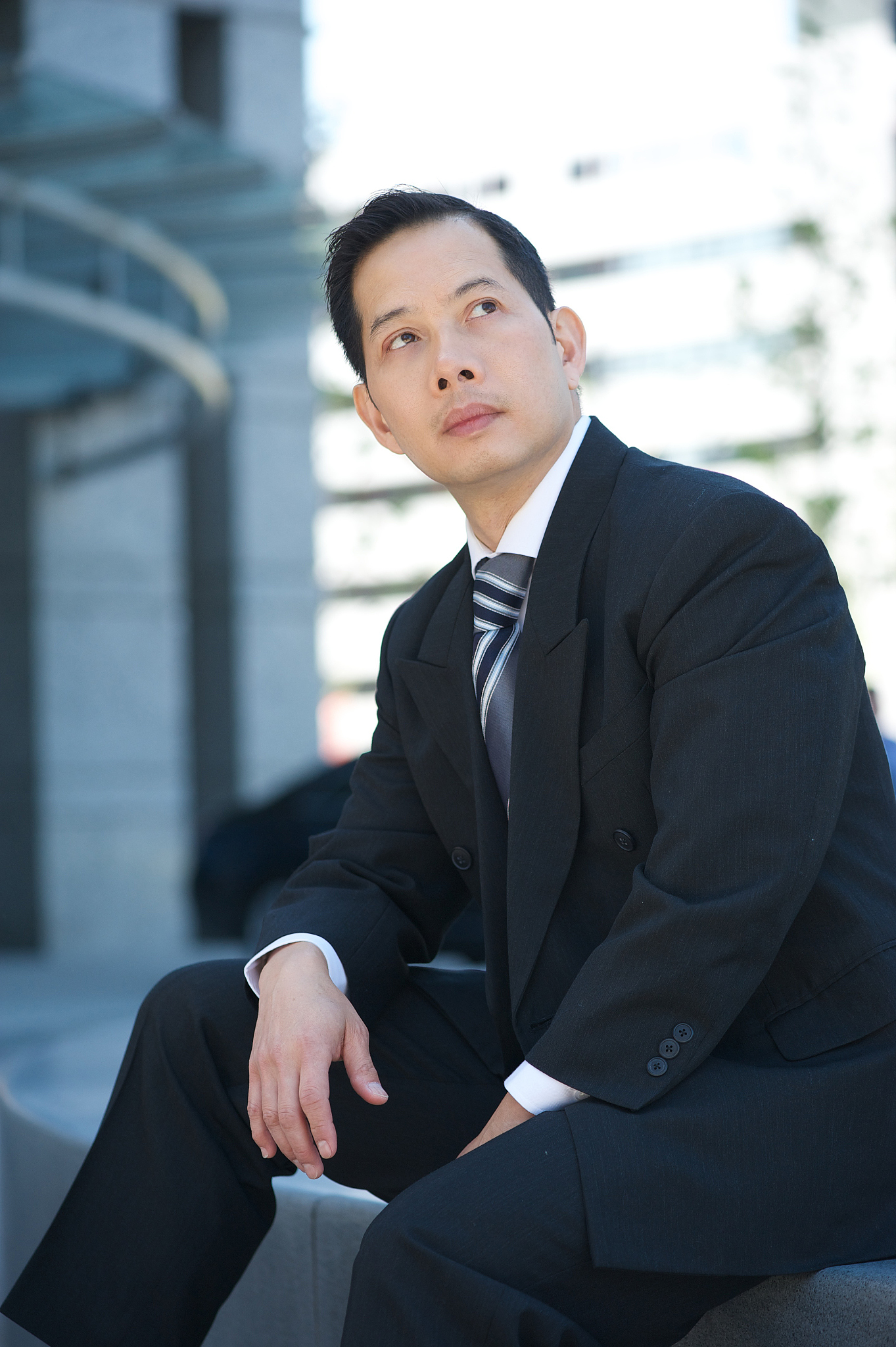 asian businessman posing outdoors