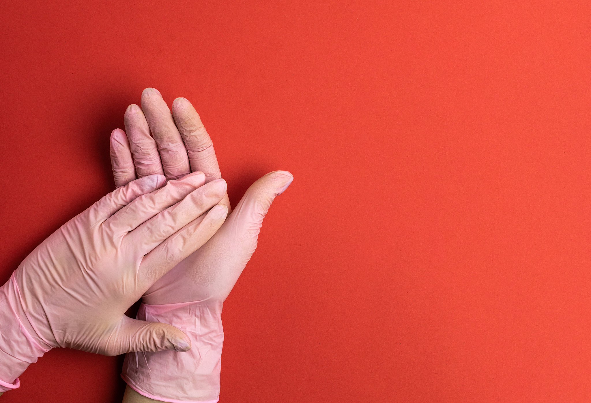 gel hands on medical red background. washing hands with antibact