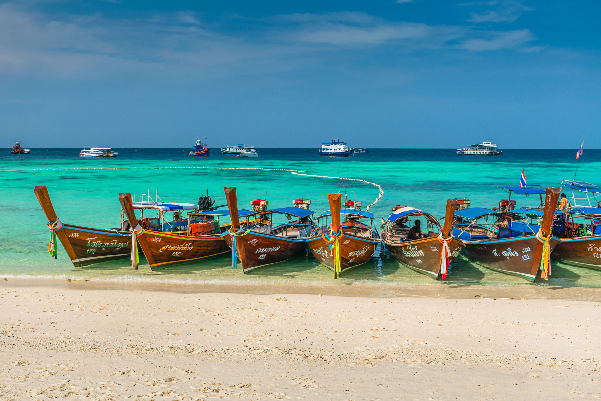 longtail boat on beach against sky at koh lipe island,thailand, 