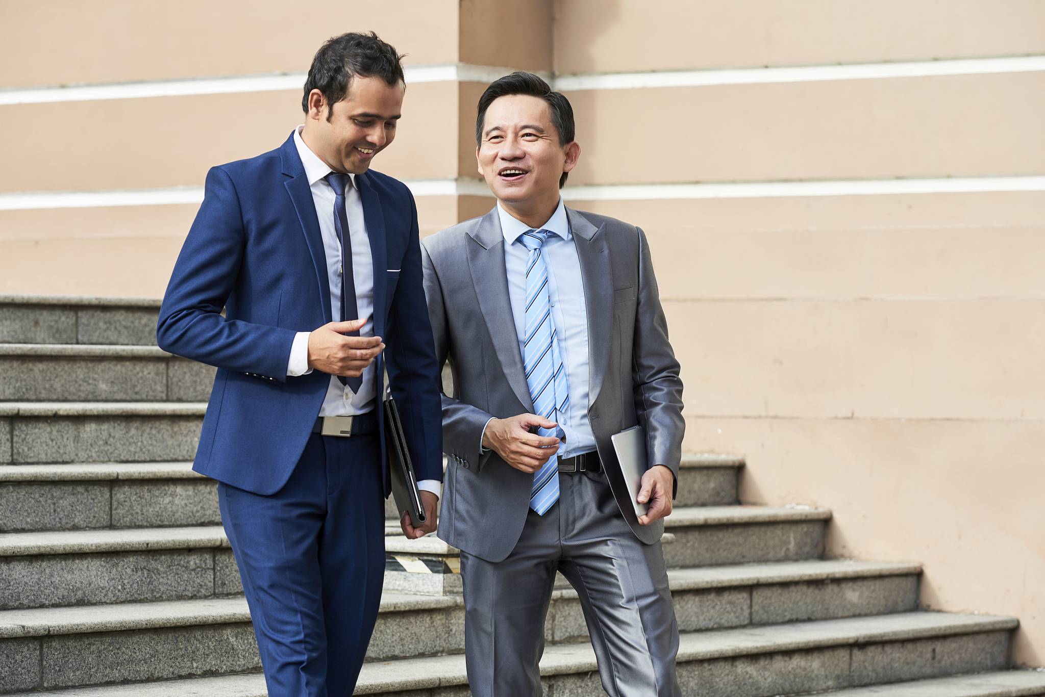 businessmen walking down the stairs