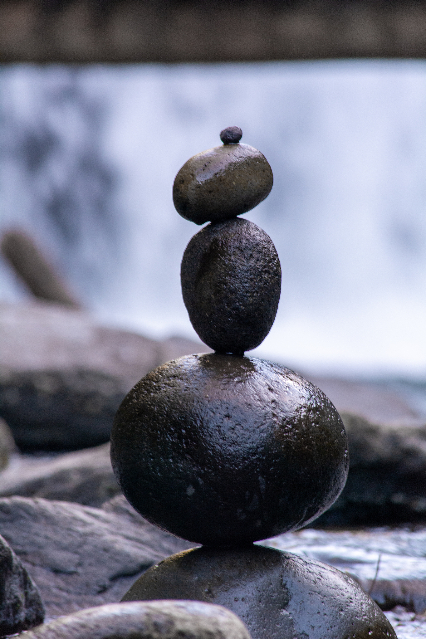 balancing stones in the waterfall
